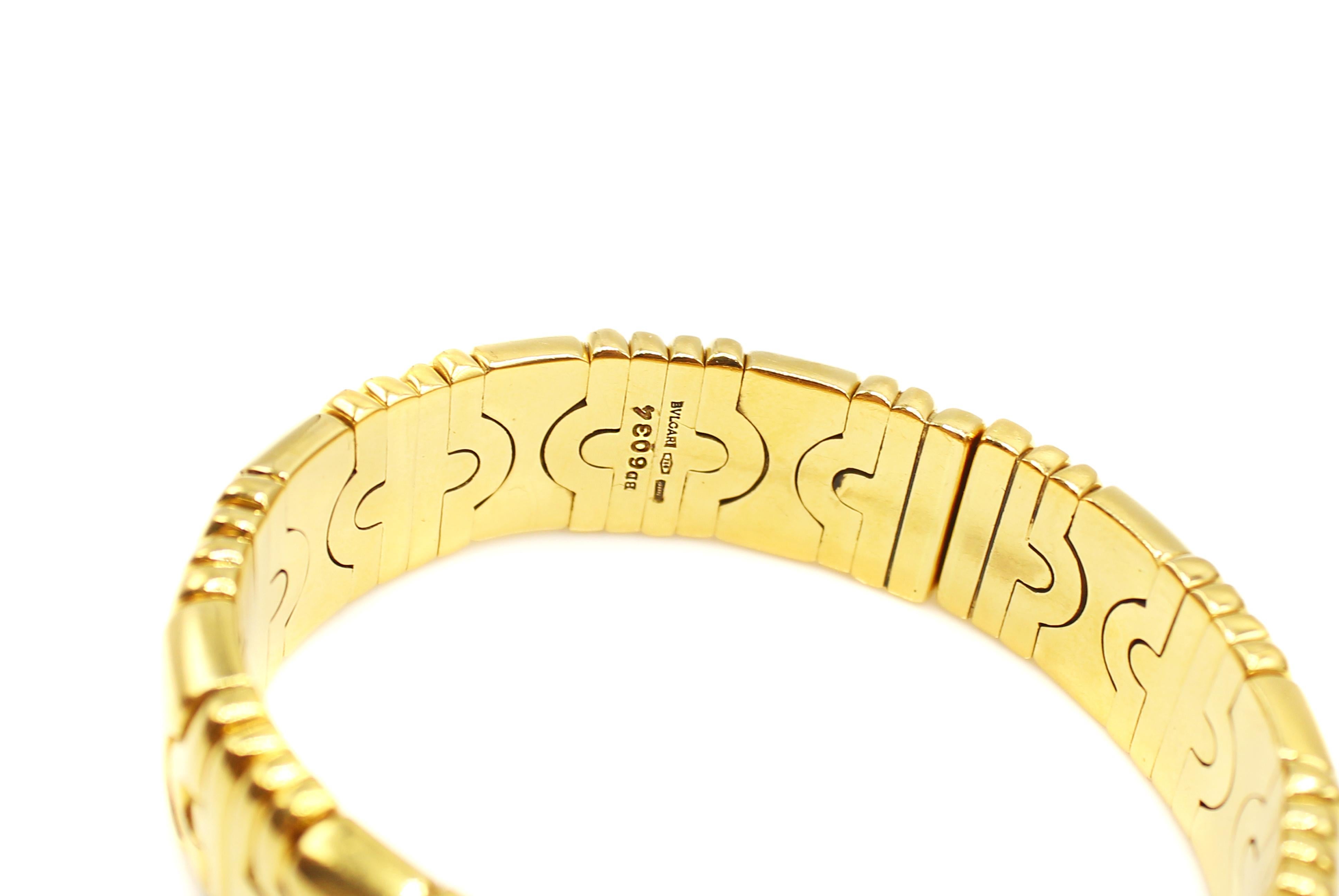 This classic Bulgari Parentesi 18K Yellow Gold is timeless, with a flexible opening for easy wear. This amazingly well hand-crafted bangle by the famous Italian jeweler was designed with an architectural geometric look which gives this piece of chic