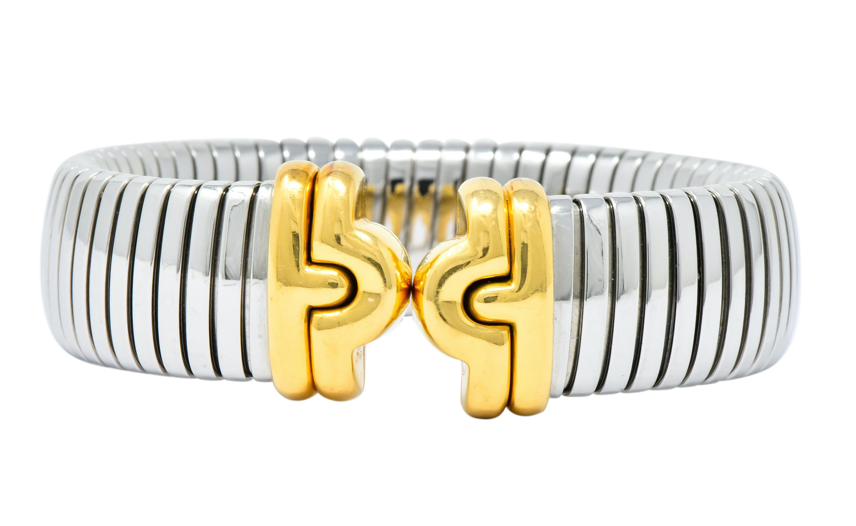 Cuff bracelet made with tubogas technology in the Or Et Acier style

With polished gold terminals in an arched motif

From Bulgari's contemporary Parentesi collection

Fully signed Bvlgari and stamped Made in Italy with Italian assay marks

Stamped