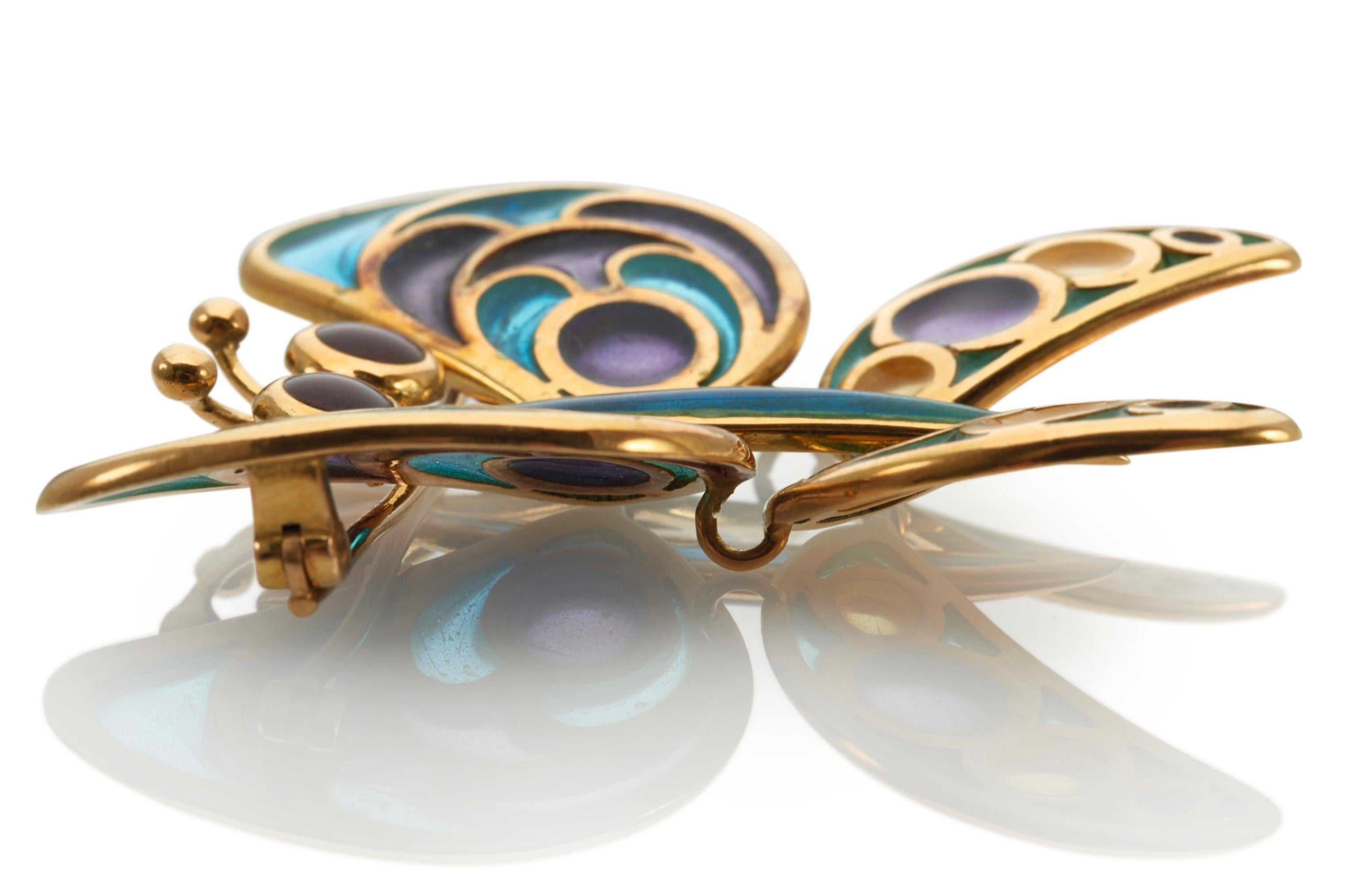 The brooch of polychrome virtue pastae designed as a butterfly from Italy.