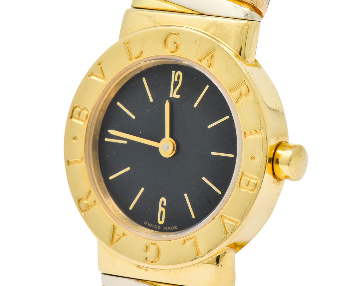 Featuring an 18 karat tri-color gold tobogas link cuff band

Black dial with sapphire crystal

Gold hour makers with double Bvlgari surround

Black dial with yellow gold indices & arrow hands

Quartz Movement 

Polished 18 karat gold

Fully signed