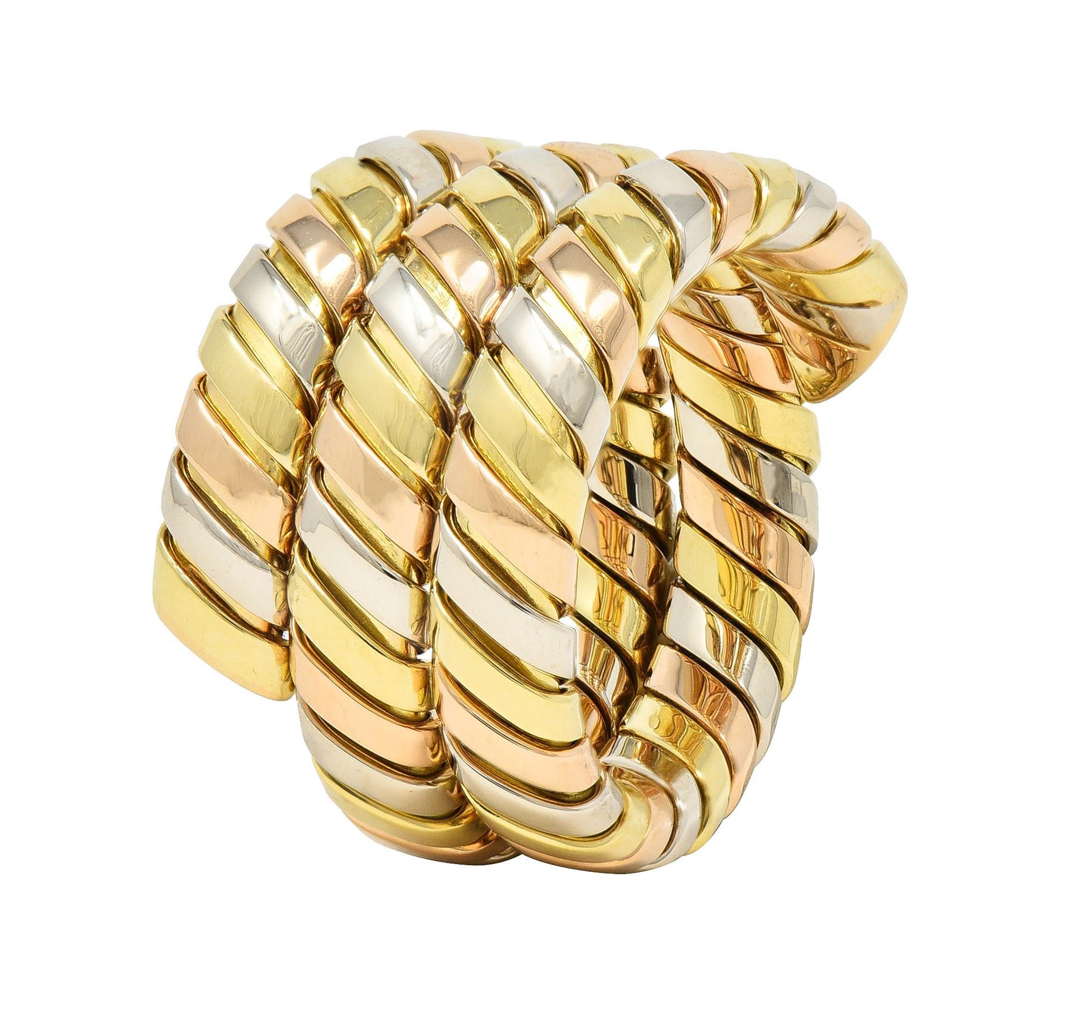 Designed as a triple wrap style ring comprised of segmented tubogas
High polished rose, white, and yellow gold
With considerable flex
Stamped with Italian assay marks for 18 karat gold
Numbered and fully signed for Bvlgari
Circa: 1990s
Ring size: 7