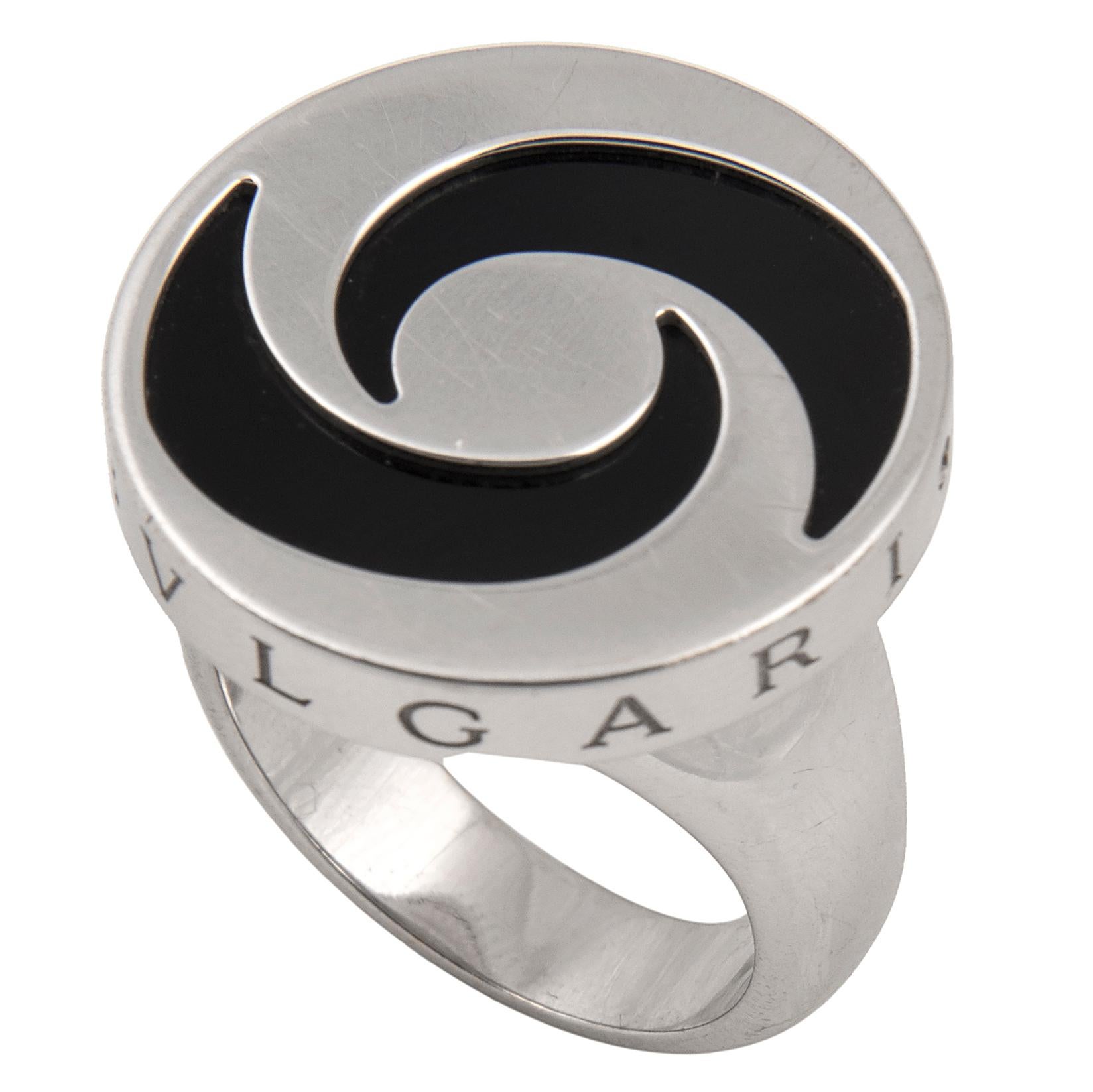 Stylish ring and bracelet from the 'Optical Illusion' series by Bulgari. The 18k white gold, stainless steel and onyx ring with a revolving disc marked Bvlgari on the sides. The 18k white gold, rubber, stainless steel and onyx bracelet with a