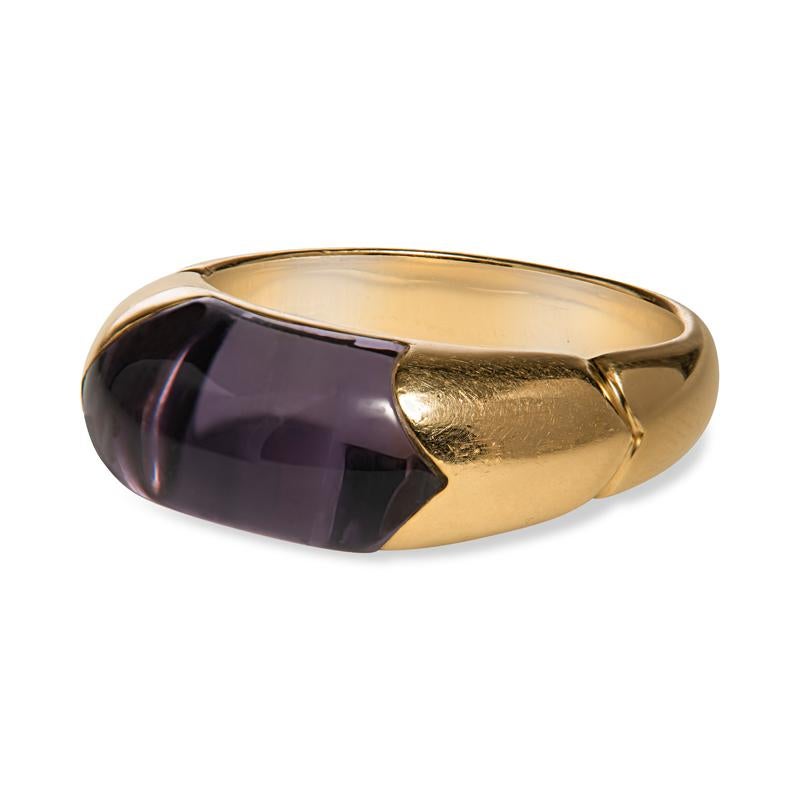 This ring from Bulgari features an amethyst cabochon set in 18 karat yellow gold. It is a size 5.75 but can be resized upon request. The ring is signed Bulgari, made in Italy, and marked with serial number. Serial number is xxx7A. This ring is a