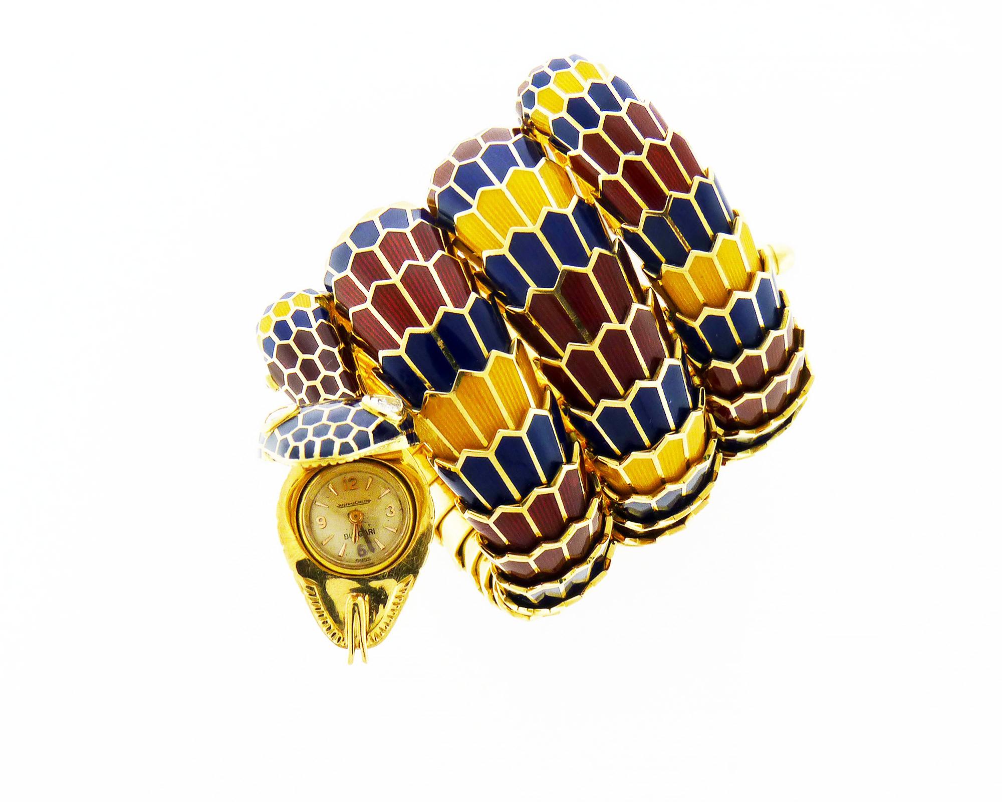 Famous vintage Bulgari bracelet-watch from Serpenti collection set in 18K yellow gold and multi-colored enamel. Jaeger Le Coultre movement.
The watch is featuring 2 pear-shaped diamond eyes. 
Signed Bvlgari. 
18K Yellow Gold weighing 214.7