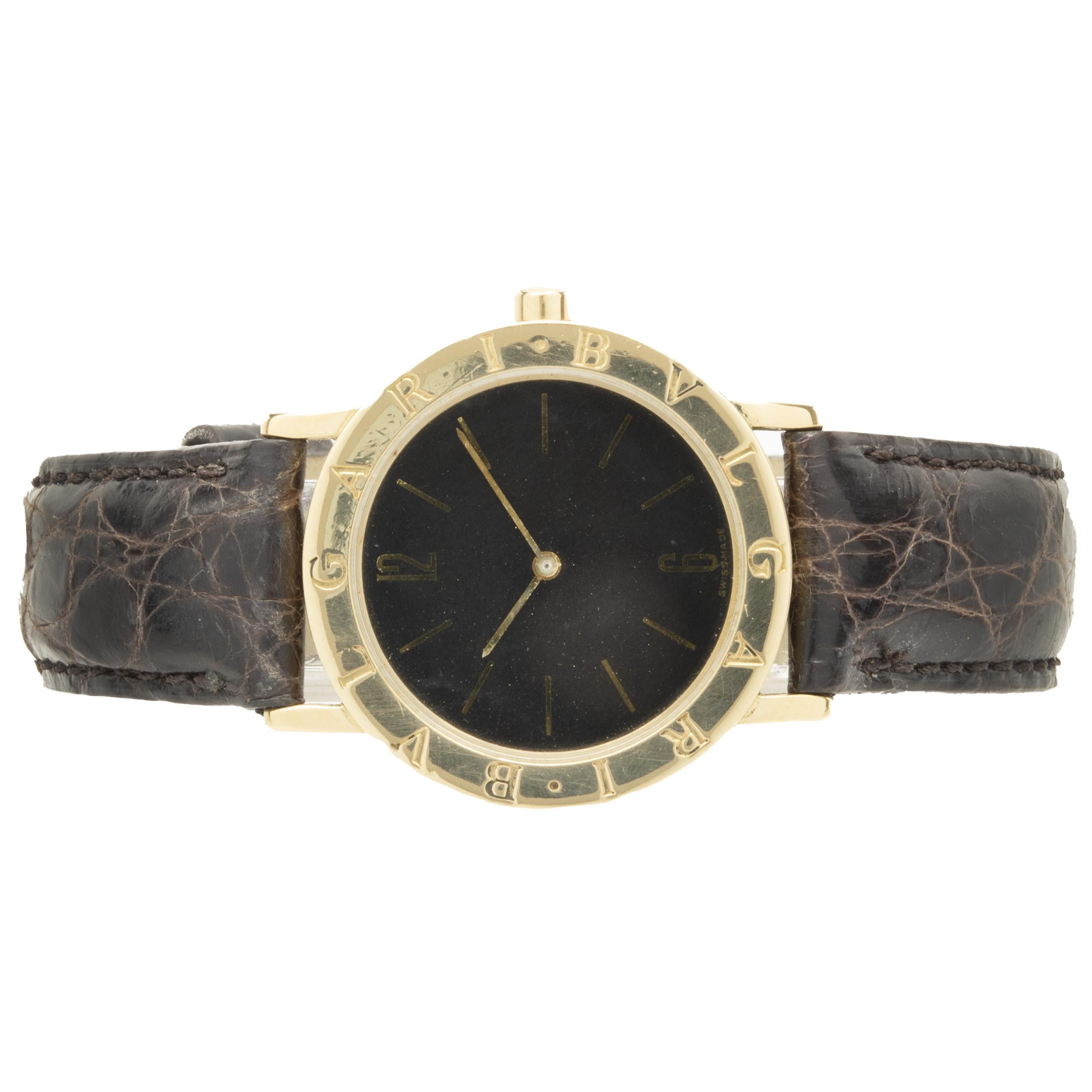 Movement: automatic
Function: hours, minutes
Case: 33mm round case, smooth Bulgari bezel, sapphire crystal
Band: Bulgari leather strap, buckle clasp
Dial: black 
Serial #: D.68XXX
Reference #: BB33GL

No box or papers included
Guaranteed to be