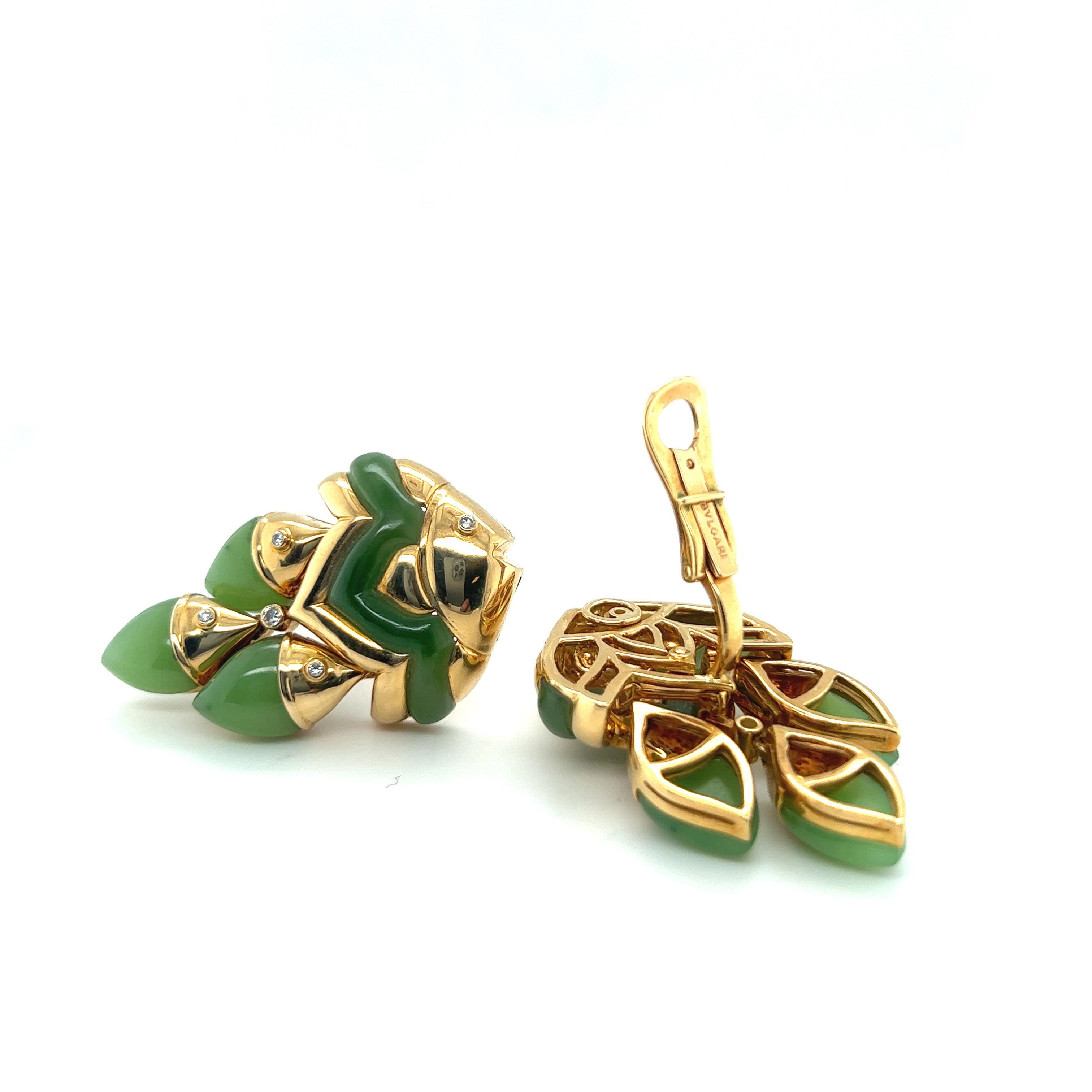 Fabulous pair of 18 karat yellow gold, diamond and chrysoprase Naturalia fish earrings by Bulgari, 1990s.

Crafted in 18 karat yellow gold, each designed as a mother fish followed by three little ones. The ear clips are decorated with olive green