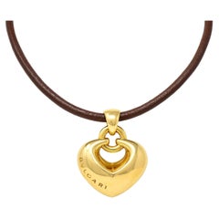 Bulgari 18 Karat Gelbgold Lederkordel-Doppio Cuore Puffed Heart Halskette