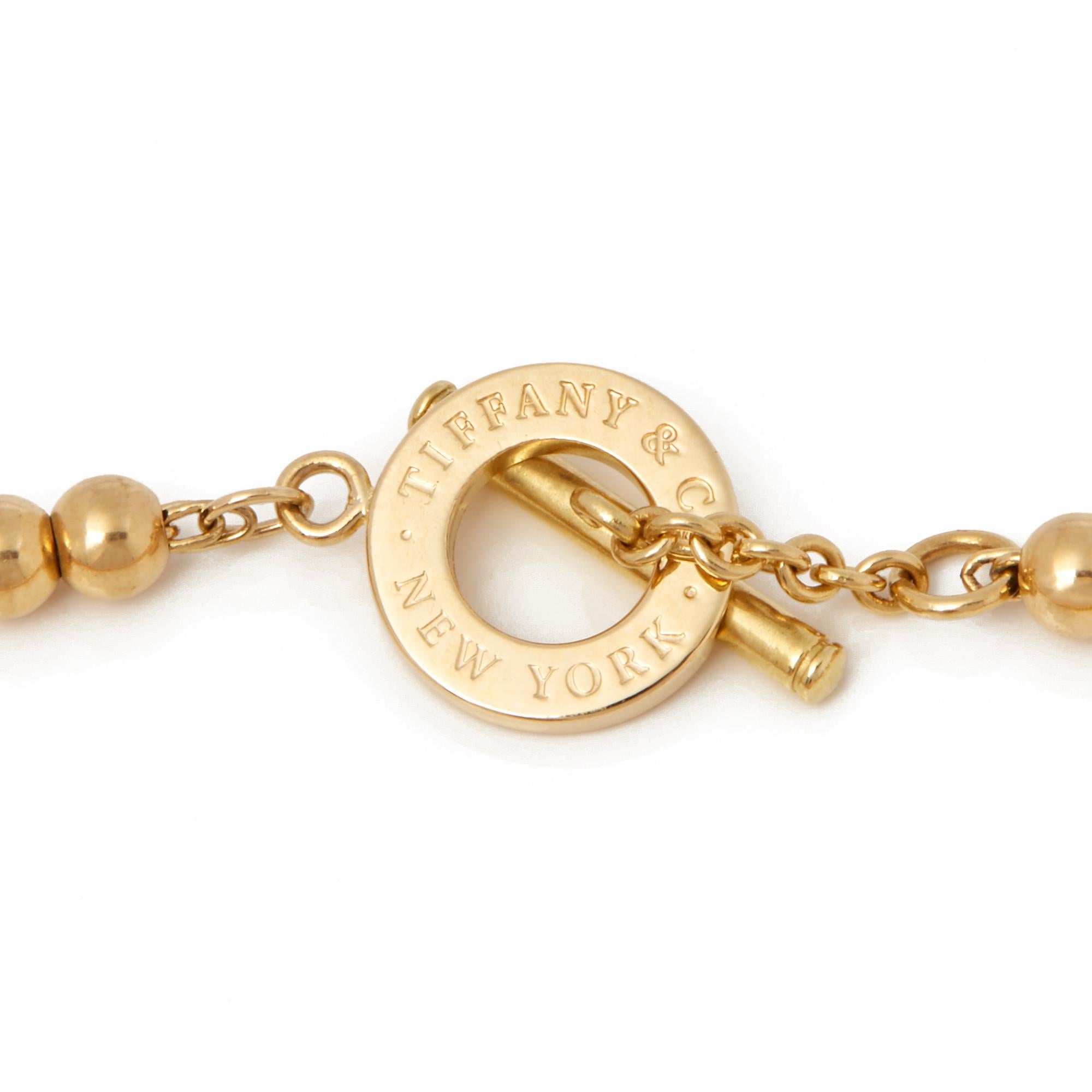Code: COM2086
Brand: Tiffany & Co.
Description: 18k Yellow Gold Tiffany Beads Toggle Bracelet
Accompanied With: Box & Papers
Gender: Ladies
Bracelet Length: 19cm
Bracelet Width: 3mm
Clasp Type: Toggle
Condition: 9
Material: Yellow Gold
Total Weight: