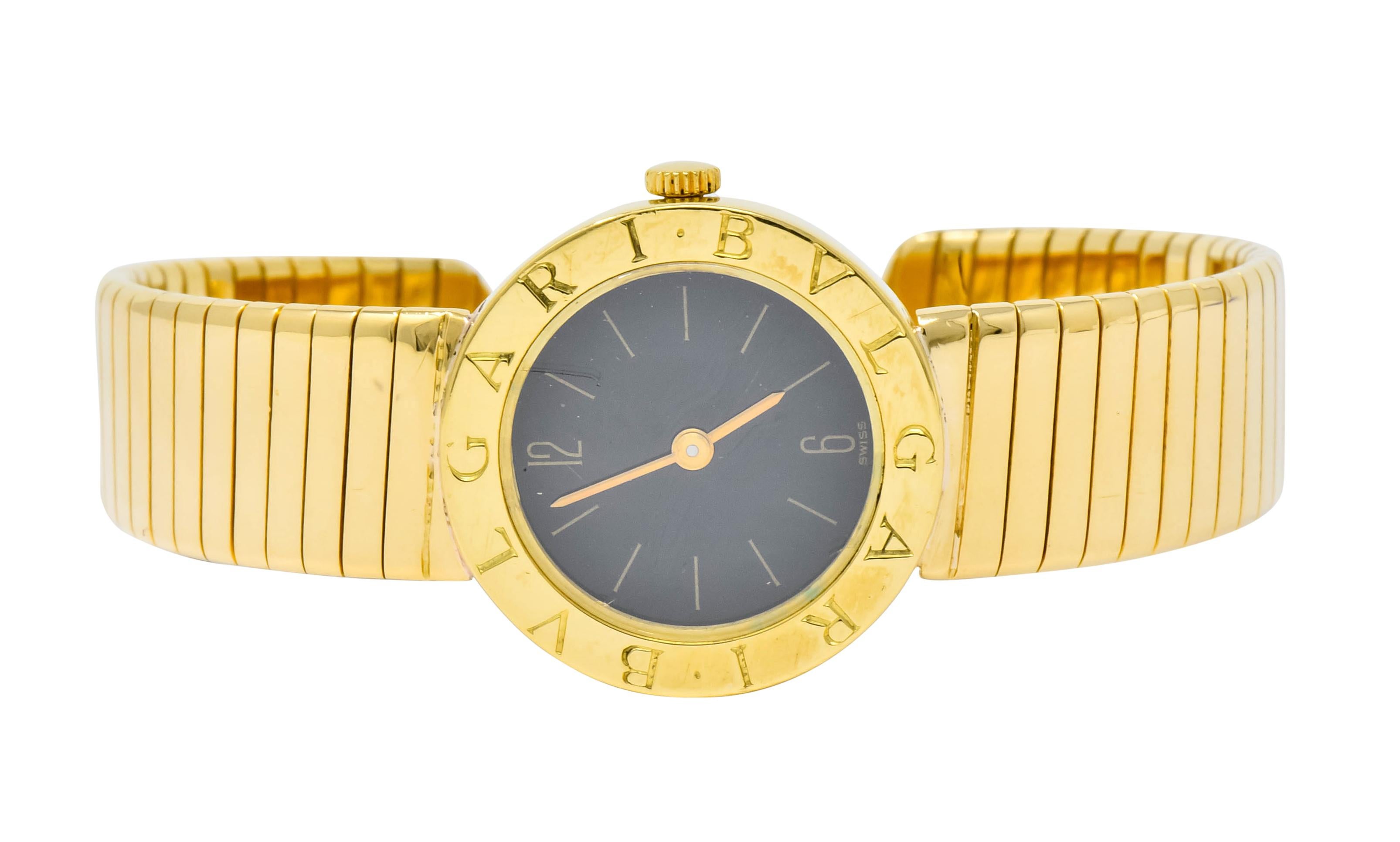 Featuring an 18 karat gold flexible tubogas link cuff band

Centering a black dial with polished gold markers, covered by crystal

With circular polished gold surround deeply engraved Bvlgari

Tested as 18 karat gold

Fully signed Bvlgari and