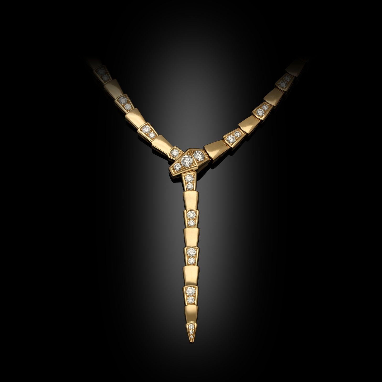 An 18ct rose gold and diamond ‘Serpenti Viper’ necklace by Bulgari, c.2022, this sinuous incarnation of the iconic ‘Serpenti’ motif is designed as a stylised snake encircling the neck and clasping its tail in its mouth, the body with exaggerated