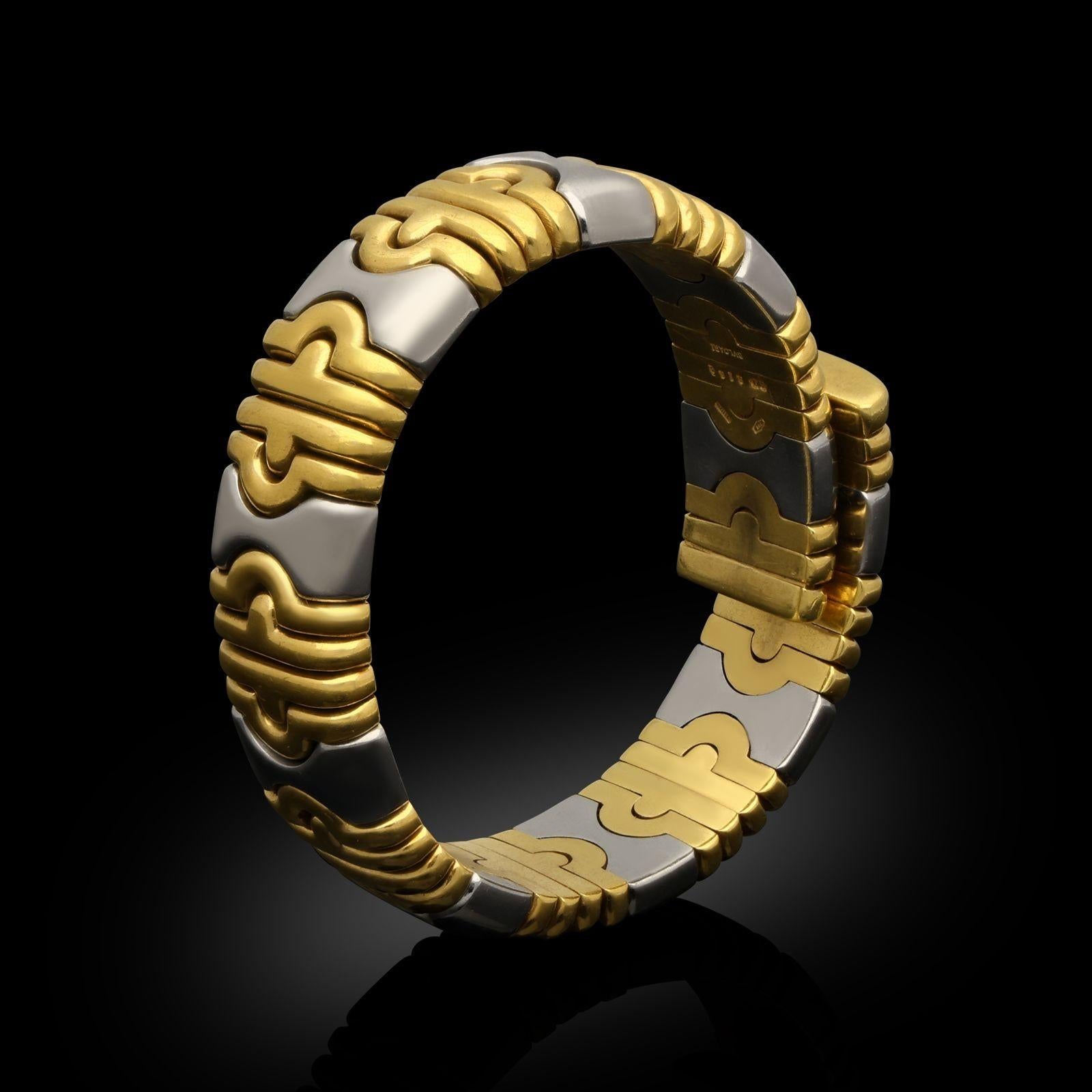 An 18ct yellow gold and stainless steel 'Parentesi' cuff bracelet by Bulgari. The bracelet is one of the iconic Bulgari designs with alternating 18ct yellow gold and stainless steel links. The bracelet is articulated and
