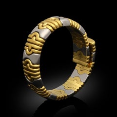 Bulgari Bracelet manchette Parentesi en or jaune 18ct et acier inoxydable Circa 1980