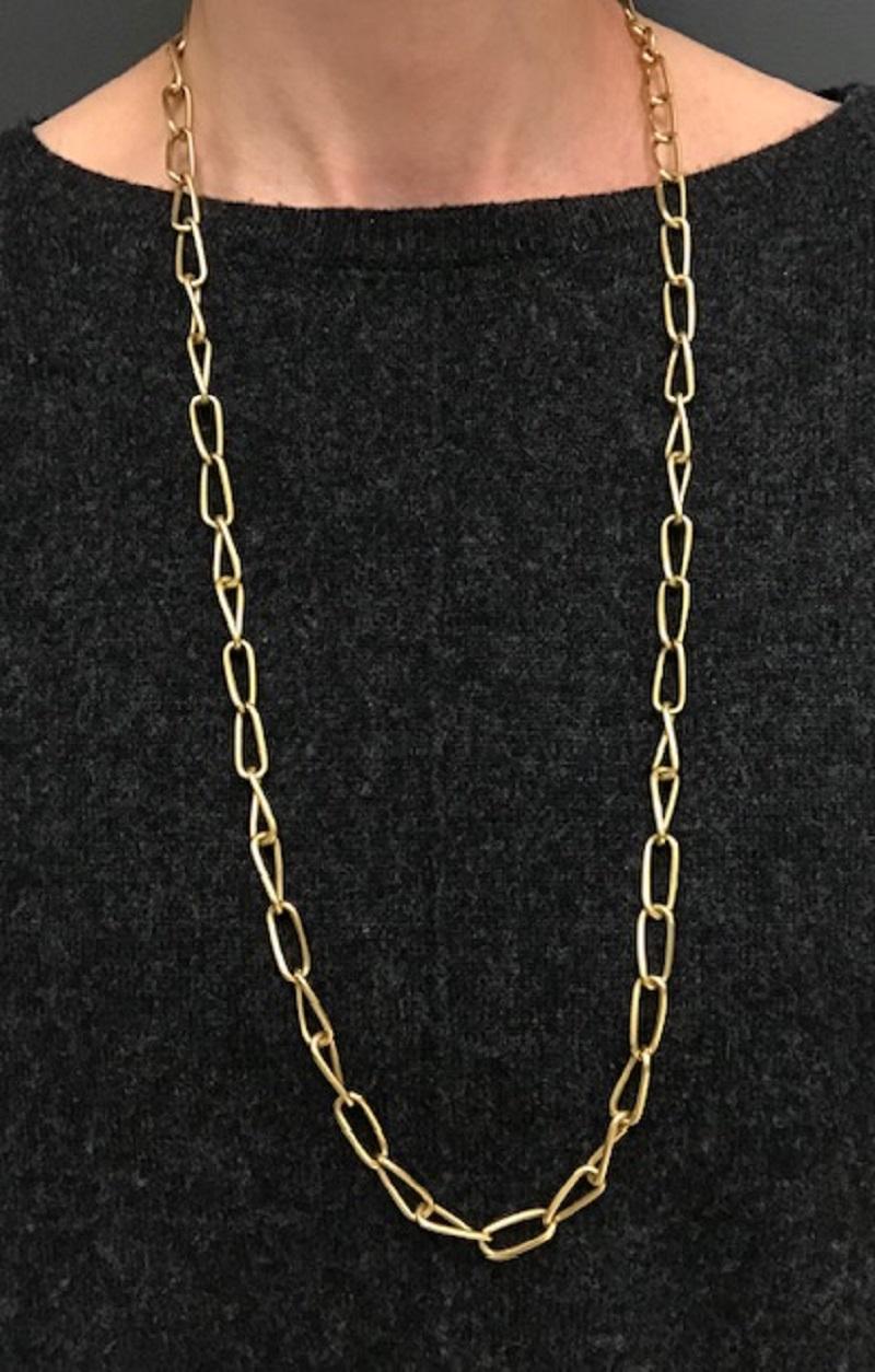A great chain necklace by Bulgari consists of slightly twisted links made of 18k gold. Matte finish and greenish gold hue create a beautiful vintage look. The elongated links cascade beautifully, making this Bulgari necklace very wearable yet