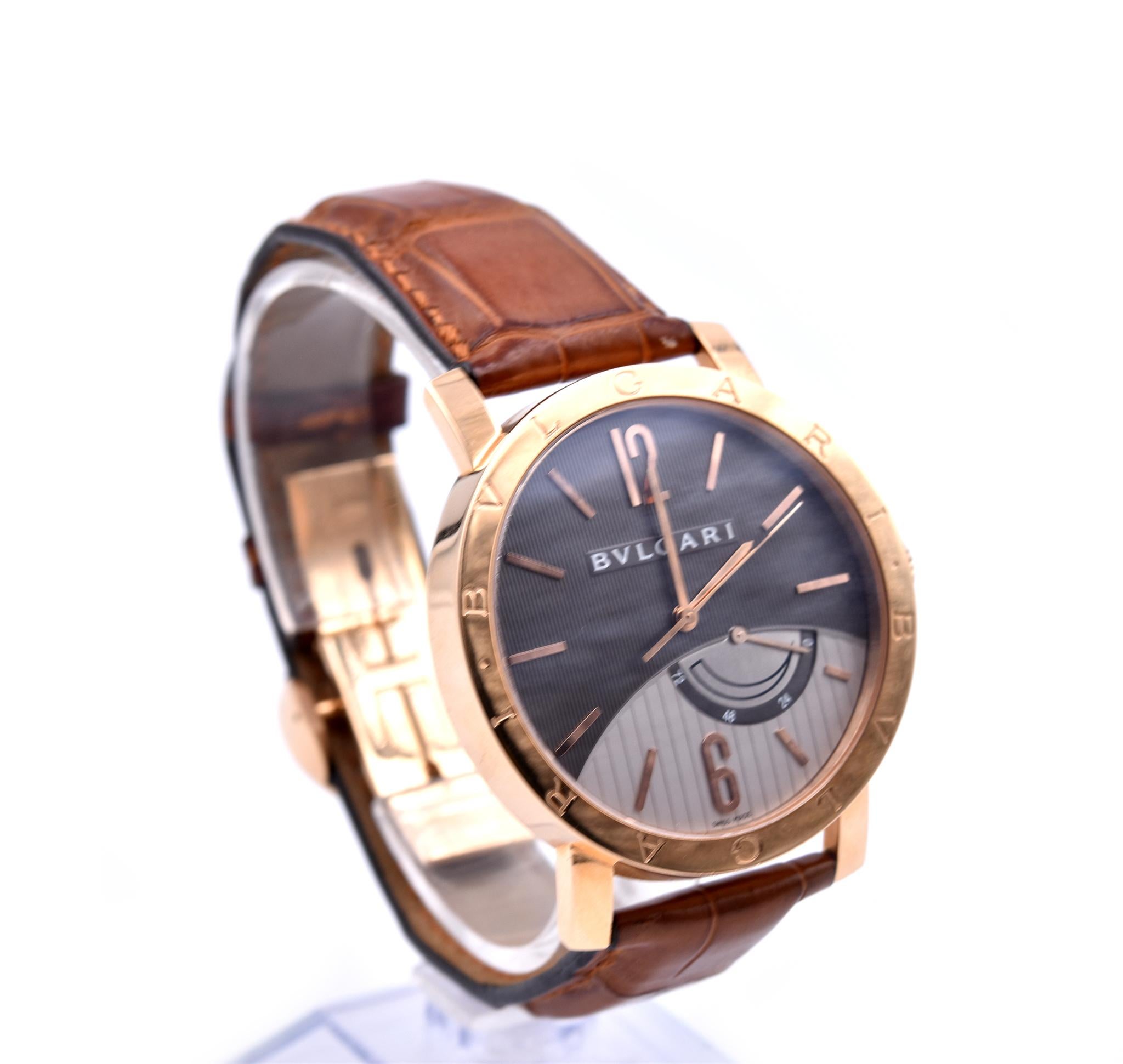Movement: automatic
Function: hours, minutes, date, power reserve indicator
Case: round 41mm rose gold case, sapphire protective crystal, 
Band: brown alligator with rose gold fold clasp hidden
Dial: silver dial with rose gold hands and Arabic