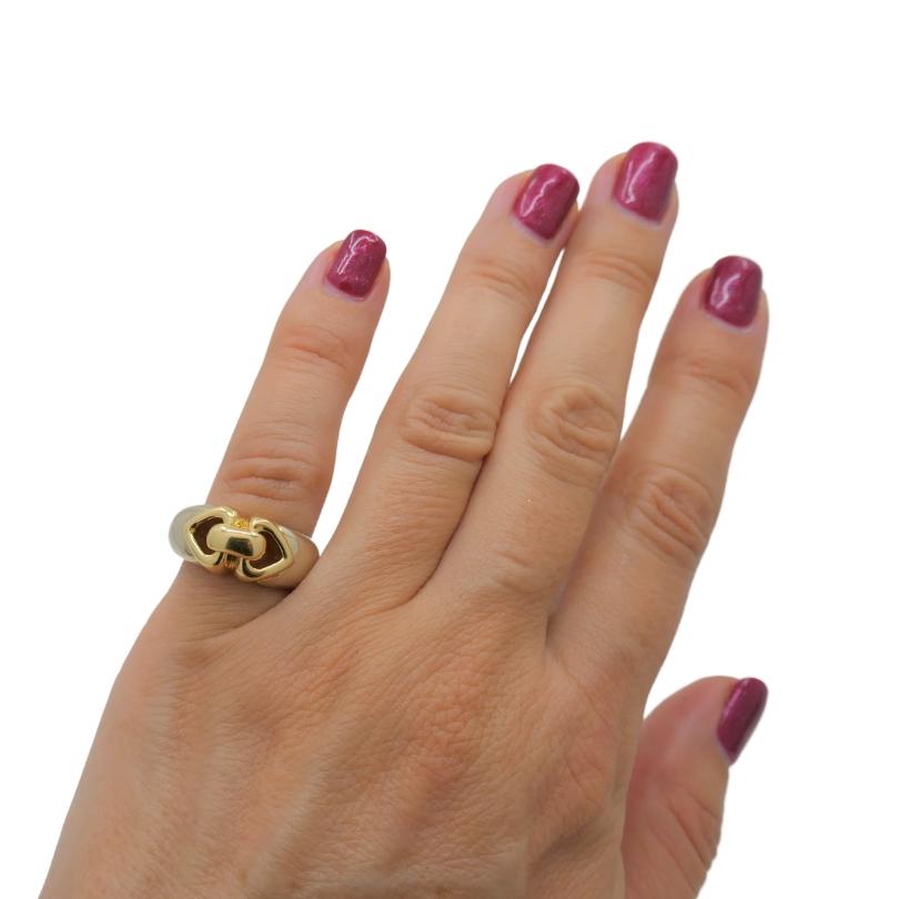 This exquisite ring embodies the essence of Bulgari's iconic design, featuring two intertwined hearts crafted in 18k two-tone gold. The Doppio Double Heart design symbolizes love and connection, making it a timeless and meaningful piece. The