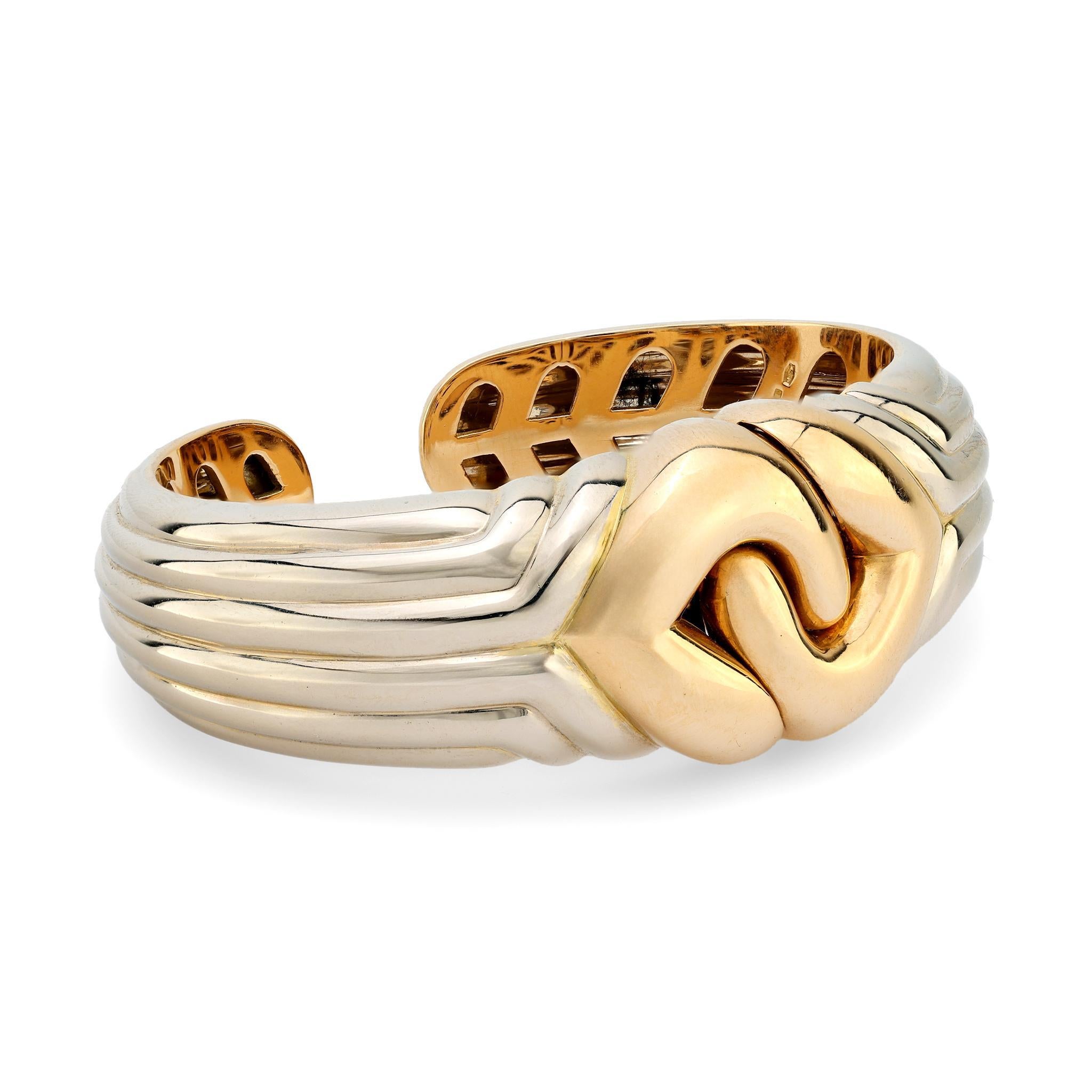 This vintage Bulgari 18k yellow and white gold bangle embodies timeless sophistication and exceptional Italian craftsmanship, making it a luxurious statement piece from the 1990s.

Brand: Bulgari
Metal: 18k yellow and white gold
Era: Vintage
Circa: