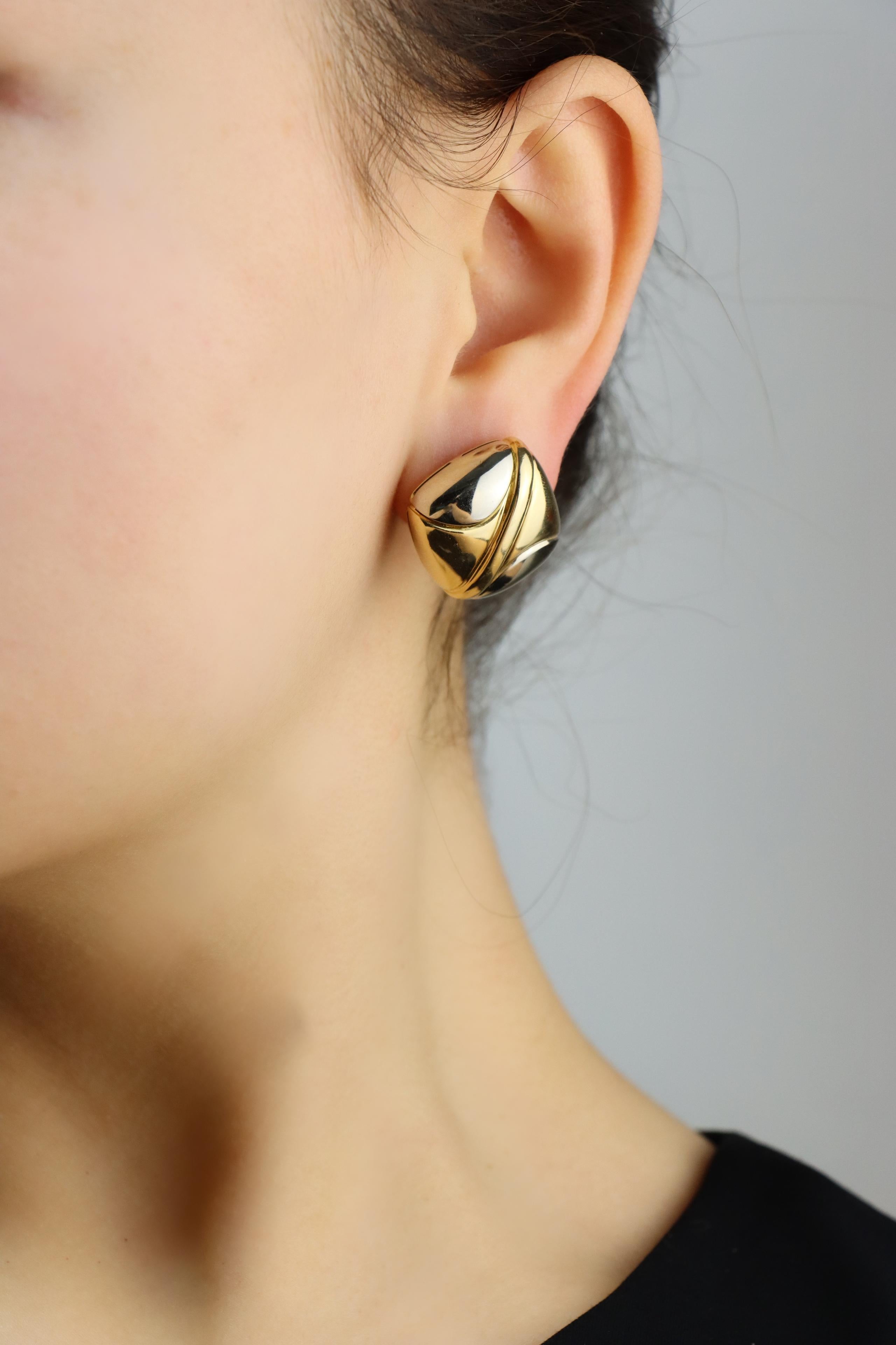 Bulgari 18K Yellow White Gold Puzzle Earring

Marked:
750
BVLGARI 

Approximate Dimensions:
2.3 cm (Length) 
2.5 cm (Width)
22.8 grams in weight.