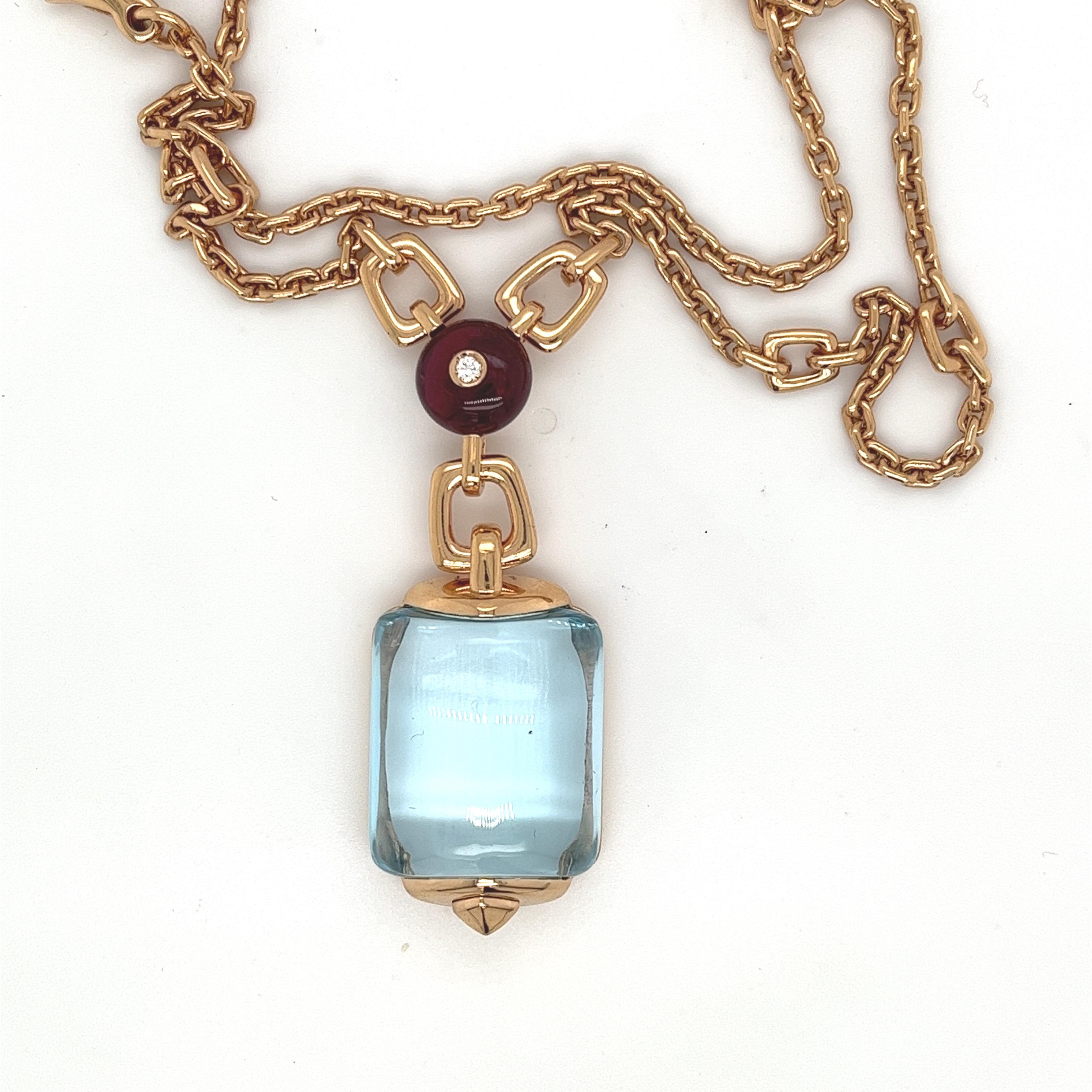 Offered here is a Bulgari handmade link chain necklace, with a large blue topaz dangling on a Ruby bead centered with a diamond.
Made in 18kt yellow gold weighing 31.40 grams, 18 inches in length.
Topaz is approx. 19mm by 17mm wide.
Hallmarked with
