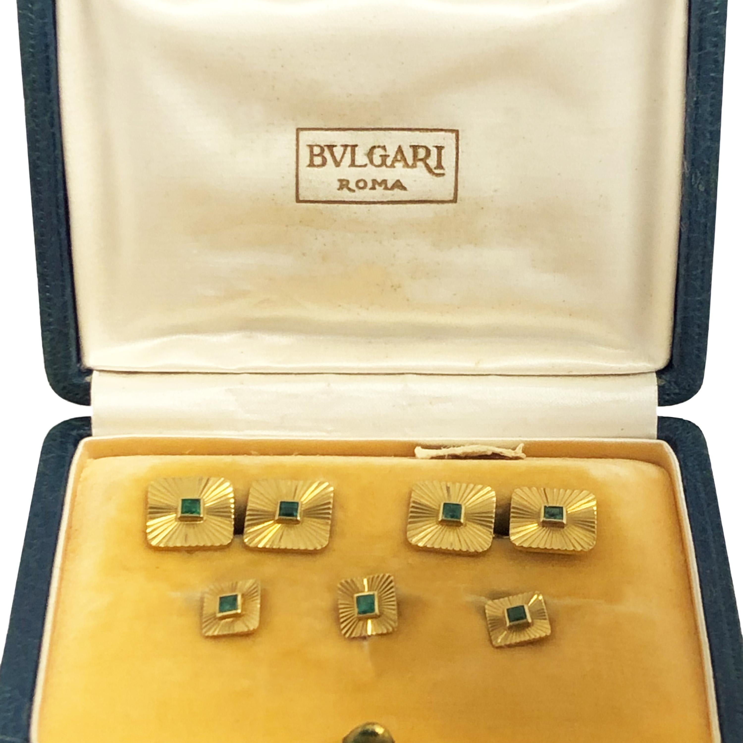 Circa 1950s Bulgari Tuxedo Cuff-link and Shirt Stud Dress set. 18K Yellow Gold cuff-links with a faceted cut design with the tops measuring 7/16 X 7/16 inch and set with Square step cut Emeralds of very fine color. 3 Shirt studs also set with
