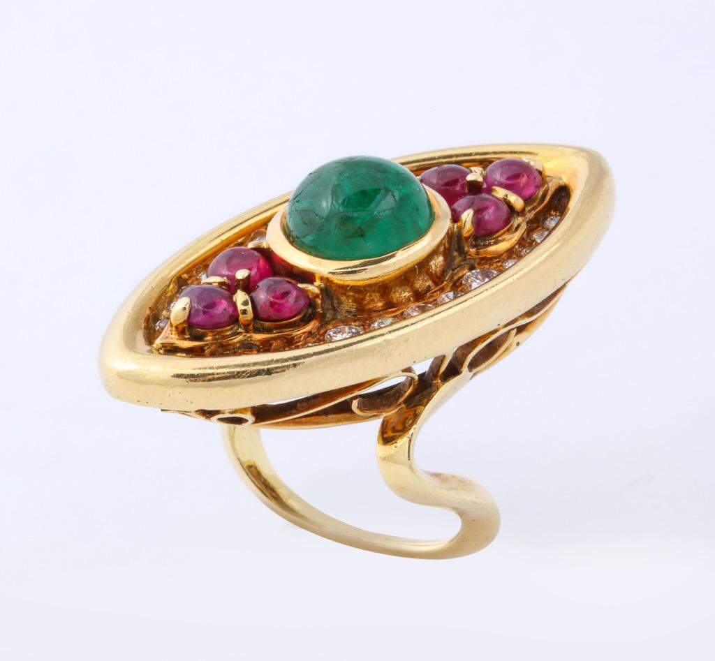 When it comes to bold and colorful jewels nobody does it better than Bulgari, and their work from the 1970s was some of the best.  The elongated marquise shaped ring features a central cabochon emerald and is further embellished with cabochon rubies