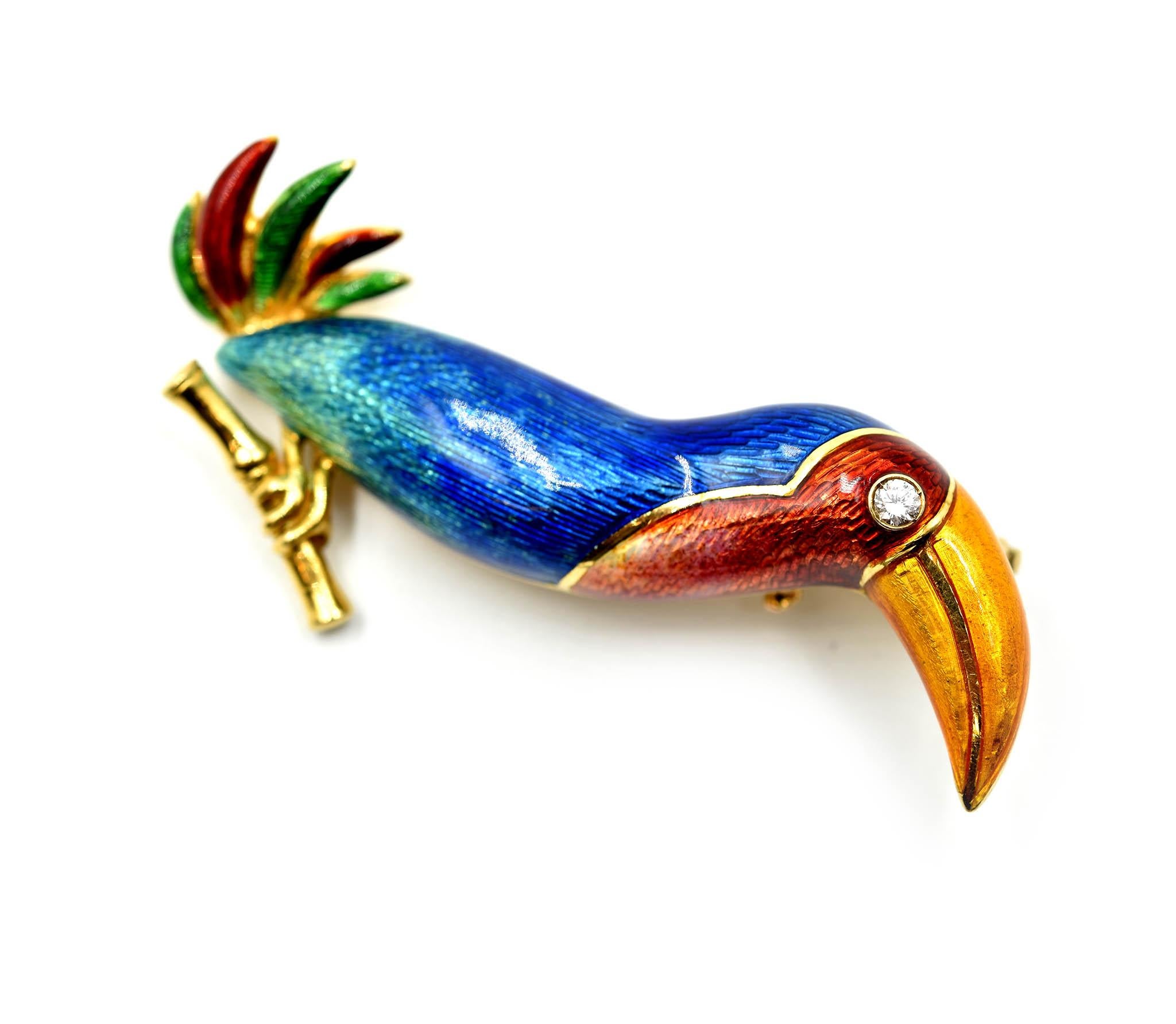 A bold and beautiful design by Bulgari! This is a toucan pin created with multi-colored enamel, 18k yellow gold and a round diamond accent. The diamond accent weighs 0.06 carats. The diamond is graded H in color and VS in clarity. The pin/pendant