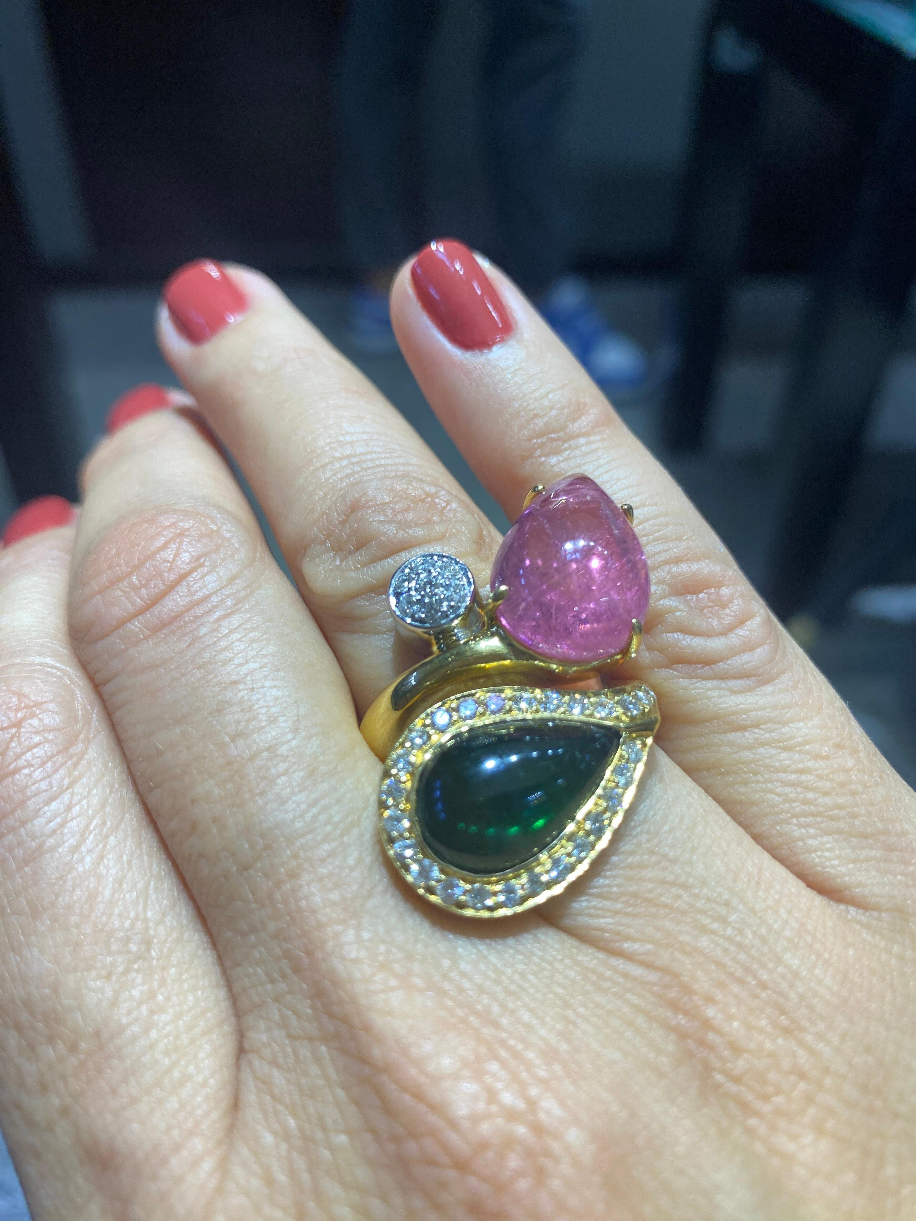 This remarkable piece by Bulgari is a most striking design consisting of 18 carat gold, diamonds and the Bulgari classics coloured tourmalines. 2 large drop shaped tourmalines, one deep green, the other a delightful pink colour are adorned with