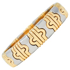Bracelet manchette Bulgari 1980 en or jaune 18 carats et acier Parentesi