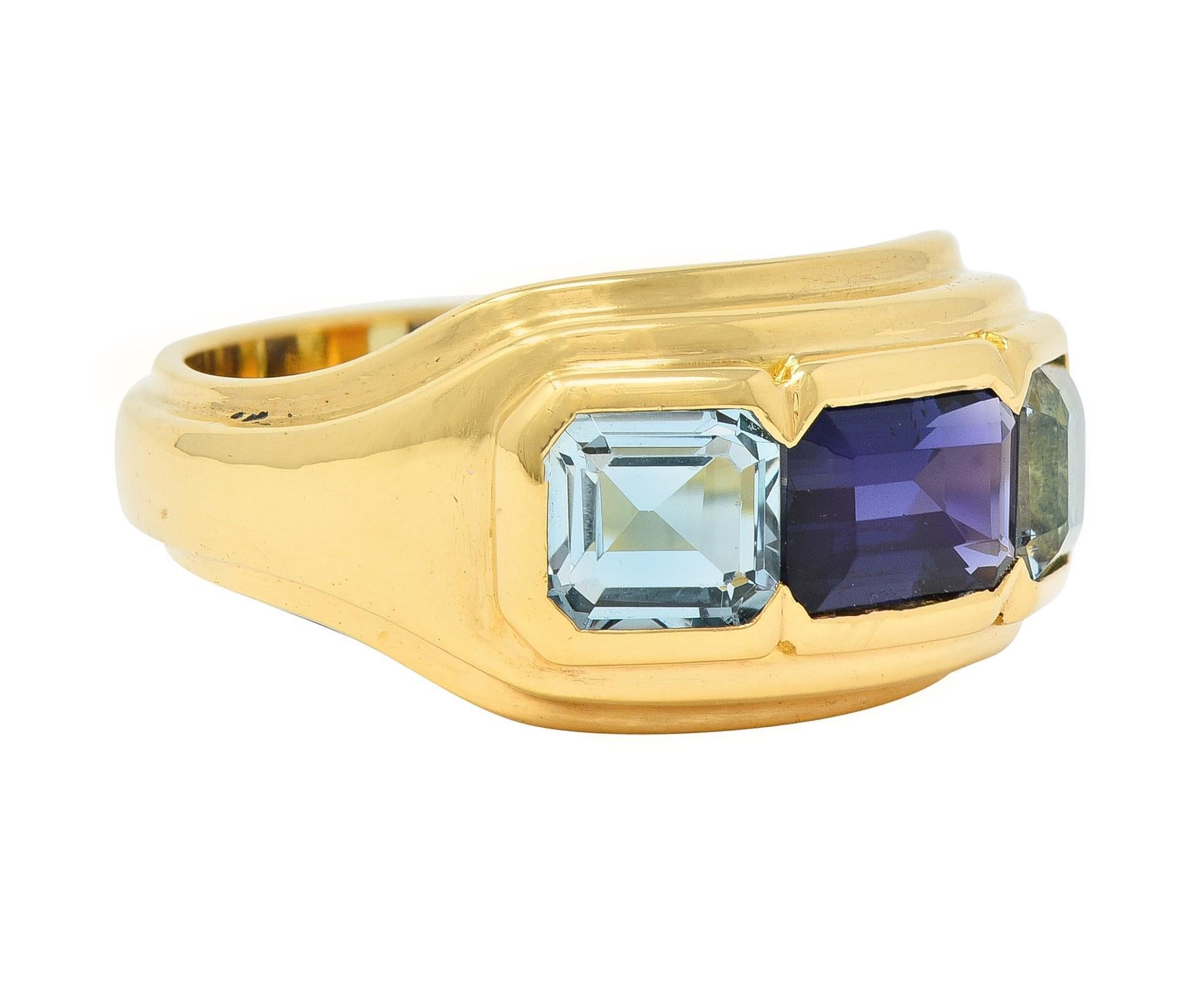 Centering an emerald cut sapphire weighing approximately 1.54 carats - transparent dark blue in color 
Set east to west and flanked by emerald cut aquamarines - weighing approximately 1.26 carats total
Transparent light blue in color - gemstones are