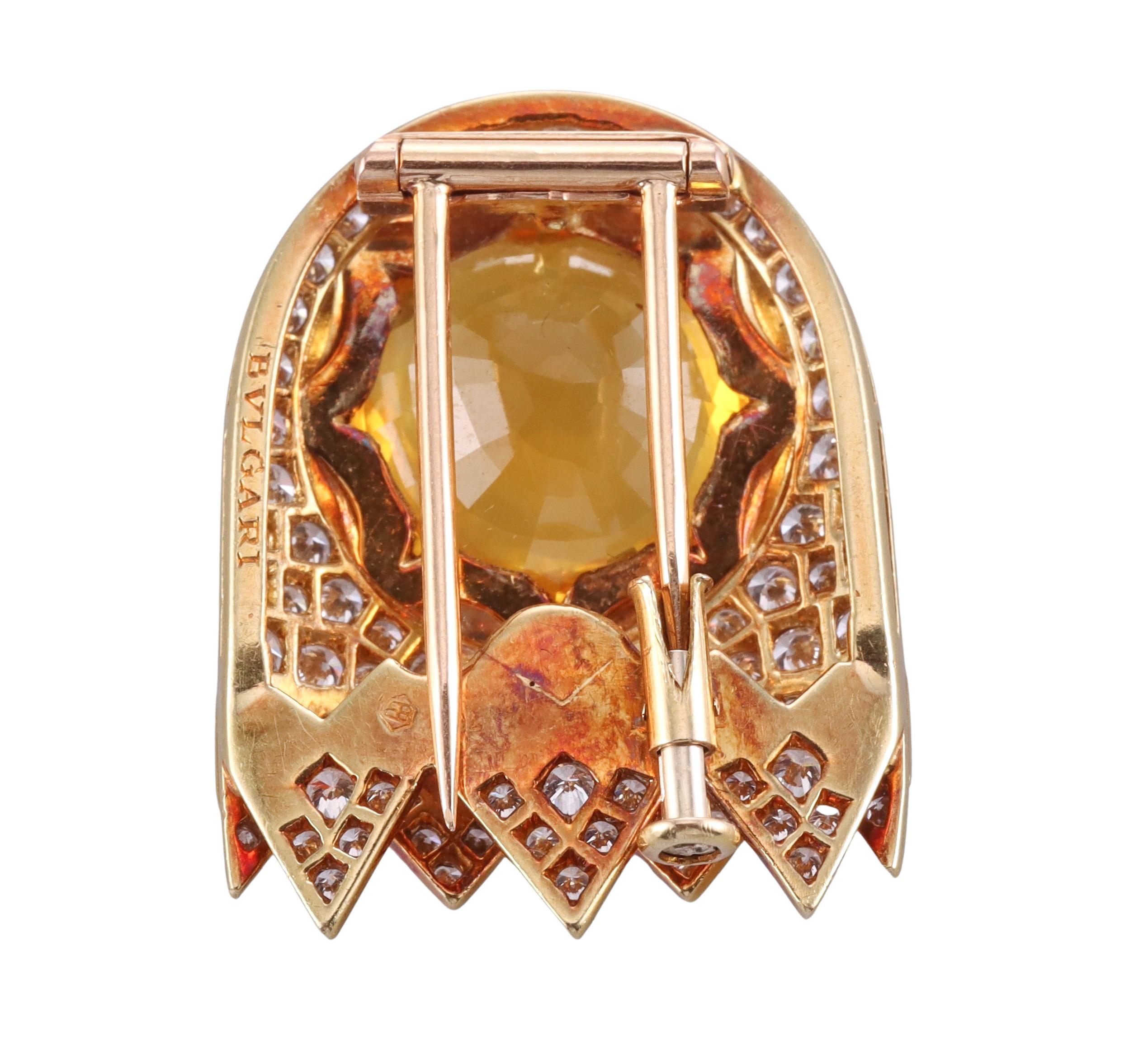 Vintage, circa 1980s Bvlgari brooch, set in 18k yellow gold, with center approx. 8ct citrine ( the stone measures 15.2 x 15.2 x 7.15mm), surrounded with blue sapphires and a total of approx. 2.50ctw in G/VS diamonds. The brooch measures 1.25