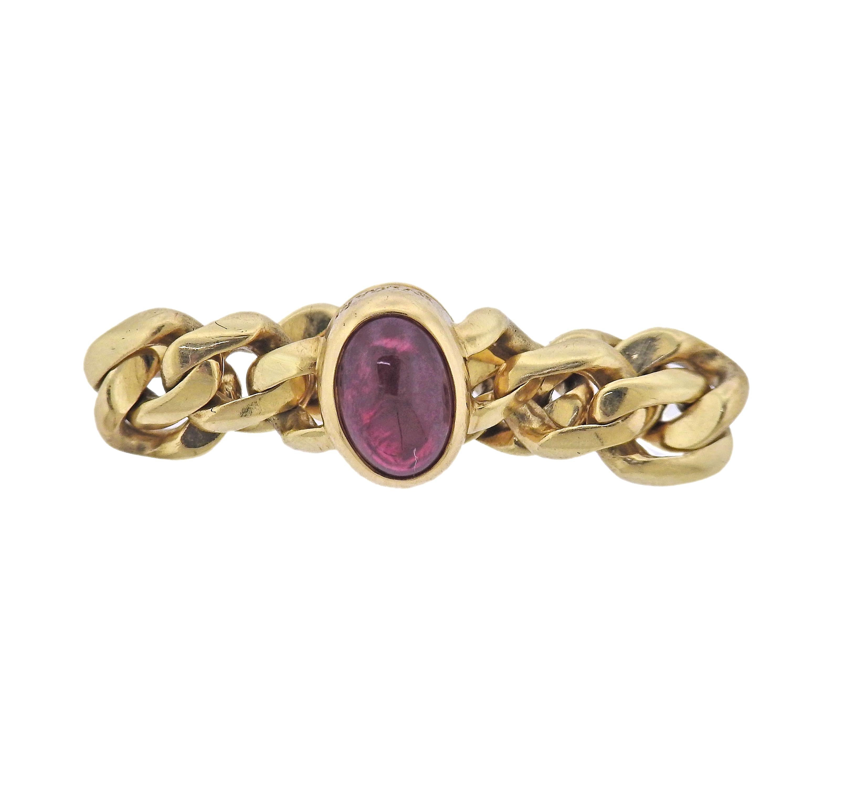 1980s 18k gold chain ring by Bvlgari, with oval ruby cabochon (approx. 2.08ct). Ring size 7.25-7.5, widest point of the ring is 10mm. Marked: Bvlgari. Weight - 7.5 grams.