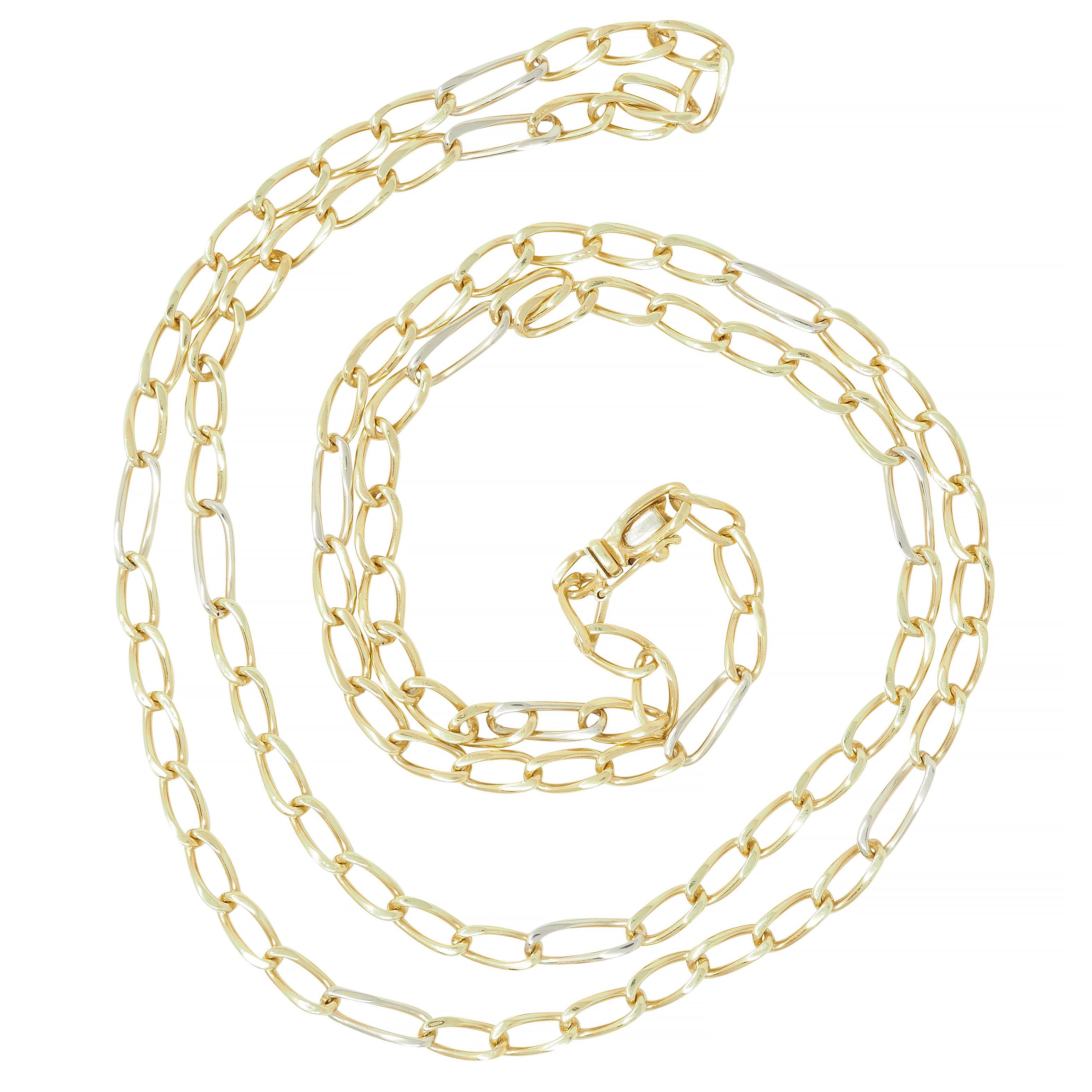 Comprised of yellow gold oval shaped twisted link chain
Accented by white gold elongated link stations
Completed by press release clasp
With hinged figure eight safety
Stamped for 18 karat gold
Fully signed for Bvlgari
Circa: 1990s
Width at widest: