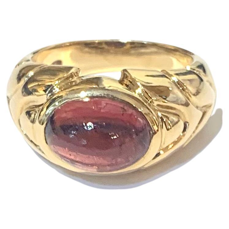 Bulgari ring in yellow gold set with a cabochon-cut tourmaline.

Signed Bulgari, Italian Work circa 1980-1990

Ring size : 10.54 x 22.27 x 8.59 mm (0.415 x 0.876 x 0.338 inches)

Ring weight: 13 g

Tourmaline size: 10.18 x 7.67 x 4 mm (0.401 x 0.302