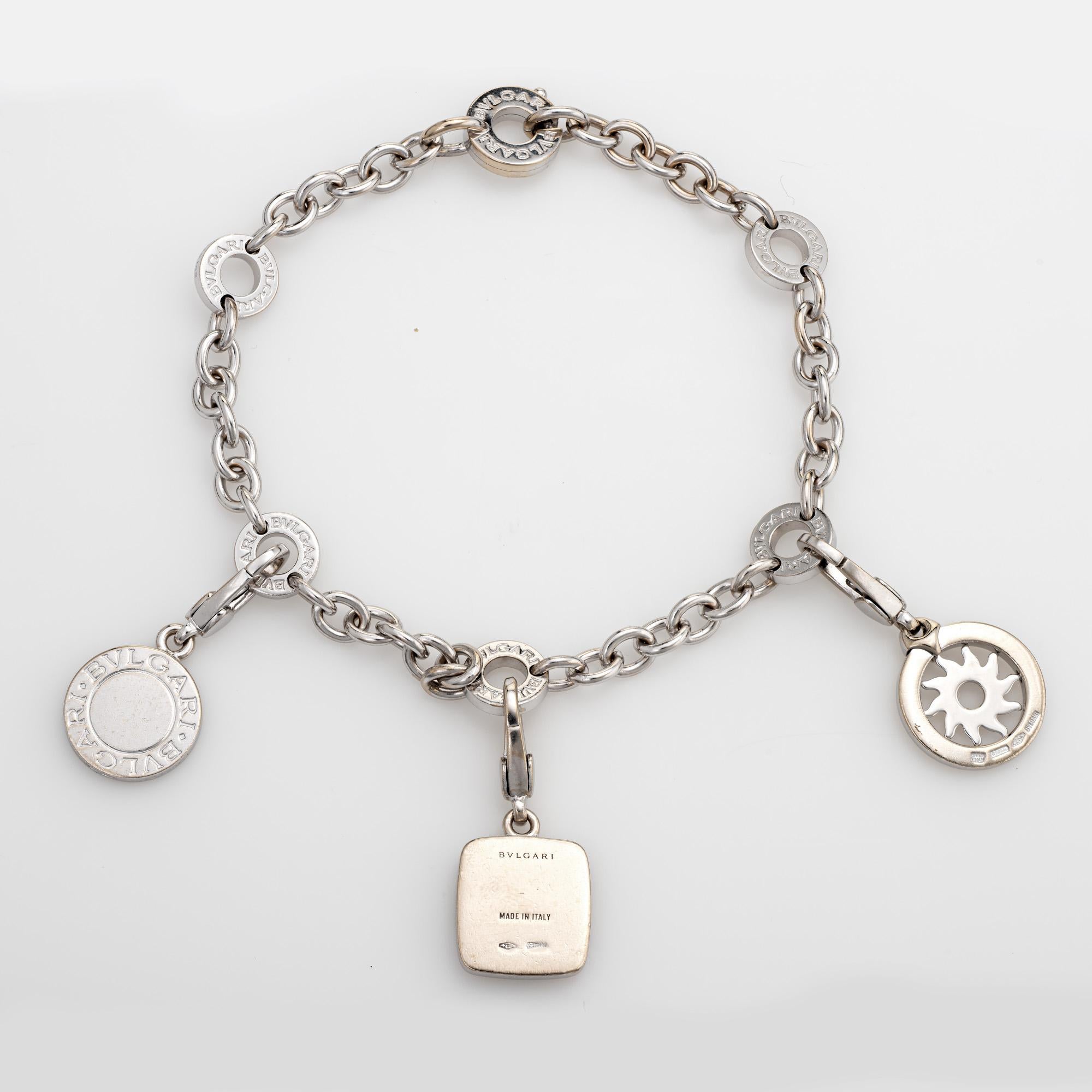 Stylish pre owned Bulgari 3 charm bracelet crafted in 18k white gold.  

The bracelet features three Bulgari charms, one set with lapis lazuli. The bracelet can accommodate more charms if desired. 

The bracelet is in very good condition and was