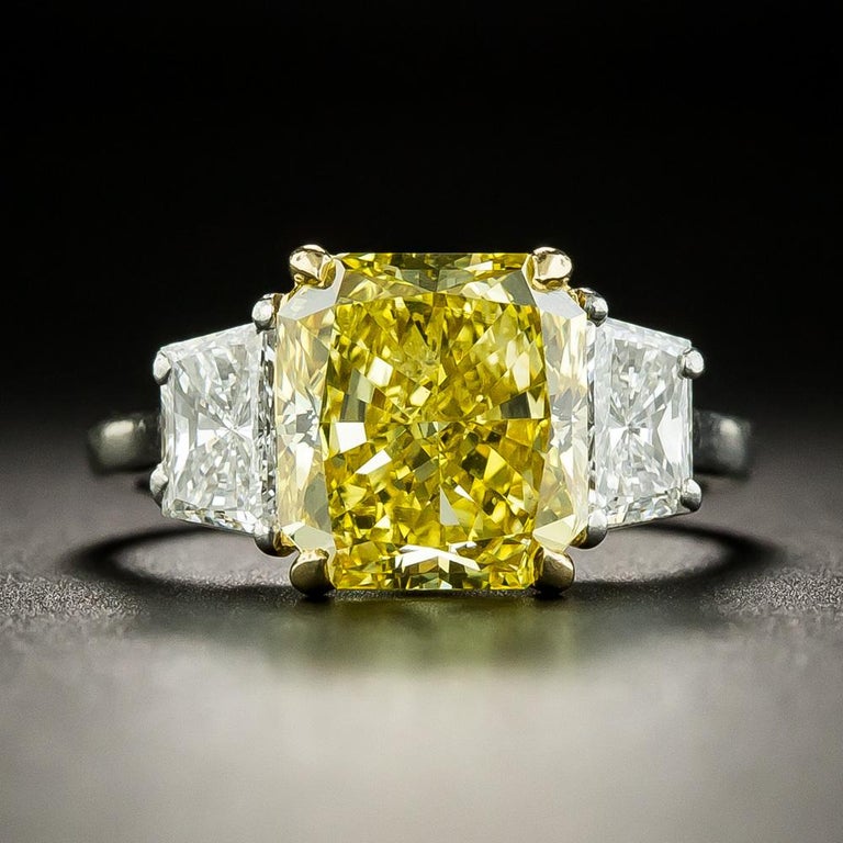 The color of this resplendent 3.78 carat Natural Fancy Vivid Yellow Radiant-cut Diamond, classically presented in platinum by Bulgari, would make any self-respecting canary blush in shame. The sensational sunshiny stone sparkles spectacularly