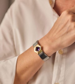 Bulgari 4ct Sugarloaf Amethyst Gold Steel Tubogas Bangle, Circa 1990