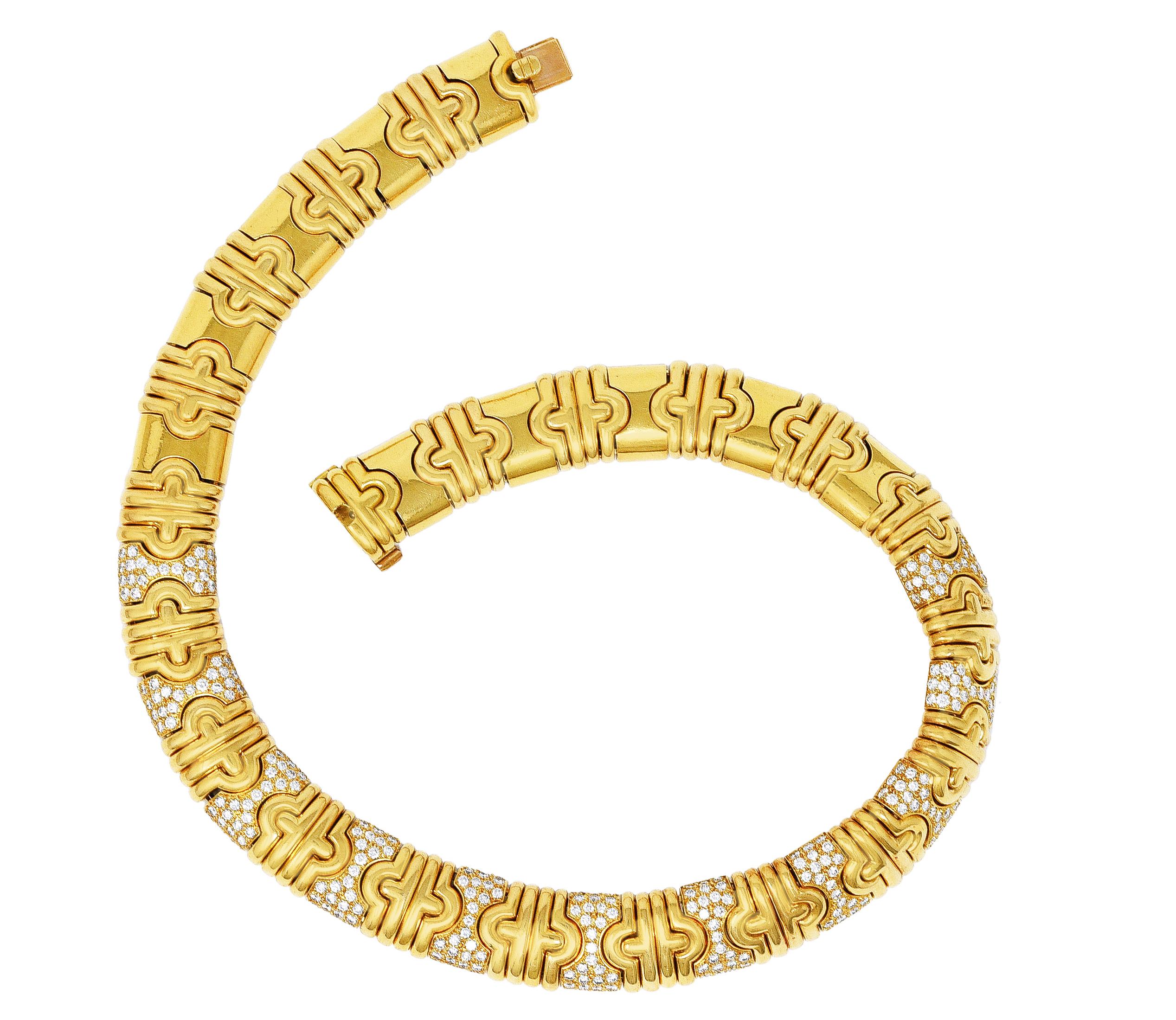 Collar style necklace is comprised of interlocking hourglass links with ribbed arch links. Hourglass links are pavè set with round brilliant cut diamonds. Weighing in total approximately 8.50 carats - F/G color with VS clarity. Completed by a