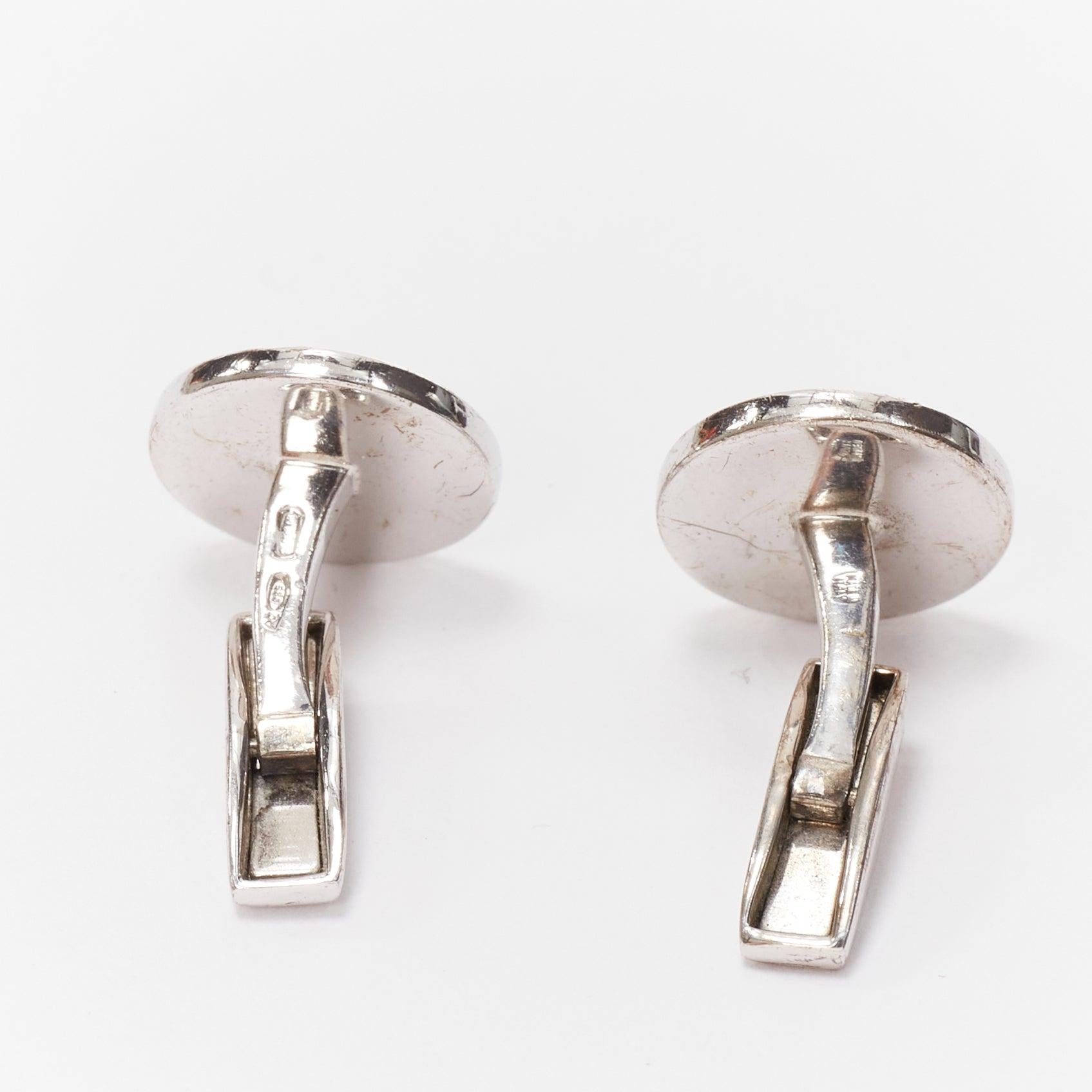 BULGARI 925 sterling silver black round onyx logo back cufflinks
Reference: YIKK/A00048
Brand: Bulgari
Material: Metal
Color: Silver, Black
Pattern: Solid
Closure: Clip On
Lining: Silver Metal
Made in: France

CONDITION:
Condition: Good, this item