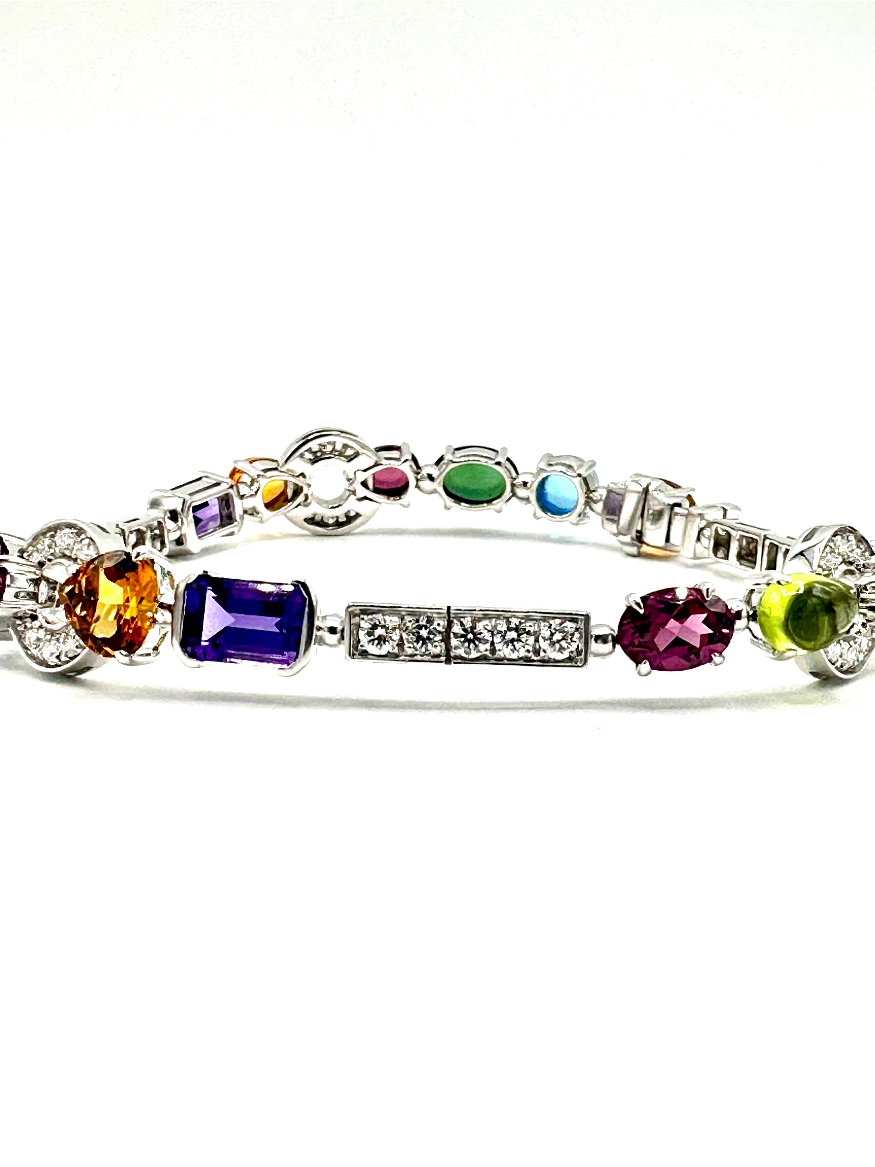 A stunning 18k white gold multi gemstone set Bulgari bracelet from the Allegra collection. The bracelet is composed of various gemstones of different cuts including, green tourmalines, peridots, amethysts, rhodolite garnets, palmeira citrines, blue