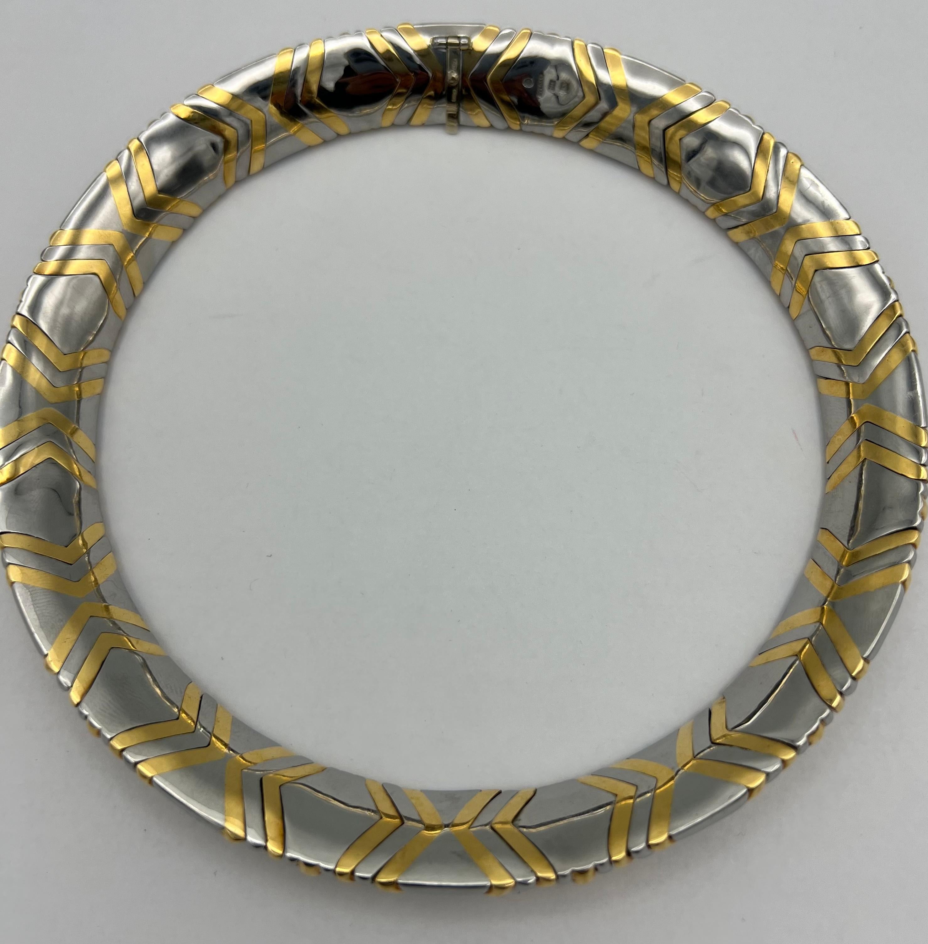 DESIGNER: Bulgari
CIRCA: 1980
MATERIALS: 18K Yellow Gold & Stainless Steel
WEIGHT: 162.7 grams
MEASUREMENTS: 14” x 7/8”
HALLMARKS: BVLGARI, 1988, 750
ITEM DETAILS:
A wide Bulgari Alveare necklace, made of gold and stainless steel. 

​The necklace
