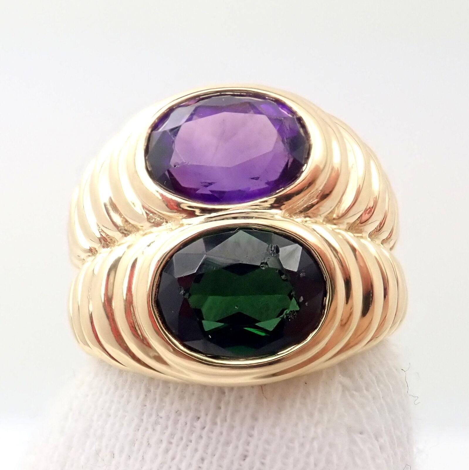 18k Yellow Gold Amethyst And Green Tourmaline Twin Doppio Ring By Bulgari. 
With 1 Amethyst 7mm x 8mm
1 Green Tourmaline 7mm x 8mm
Details:
Ring Size: 6.5 (resize available)
Width: 17mm
Weight: 15 grams
Stamped Hallmarks: Bvlgari 750 296ROMA
*Free