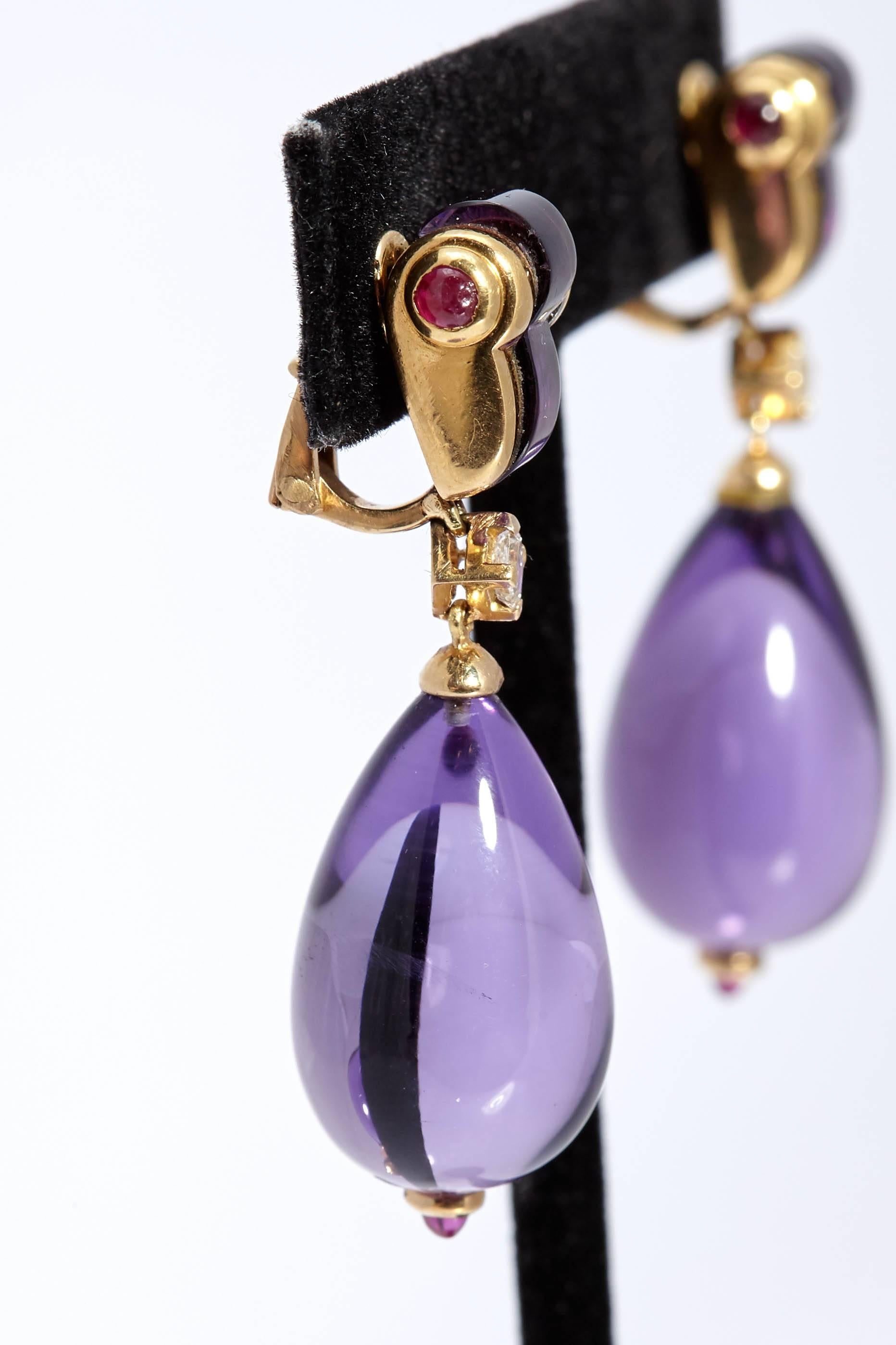 Bulgari ear-pendants in 18kt yellow gold with amethysts, diamonds and rubies. Made in Italy, circa 1980s.