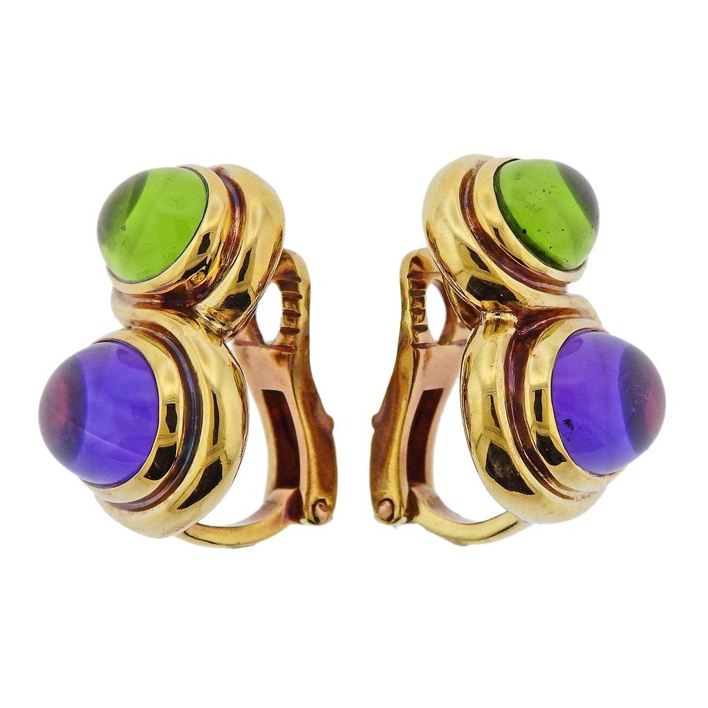 Pair of 18k yellow gold Bvlgari earrings, set with peridot and amethyst cabochons. Earrings are 21mm x 15mm. Weight is 20.8 grams. Marked 750, Bvlgari, Italian mark.