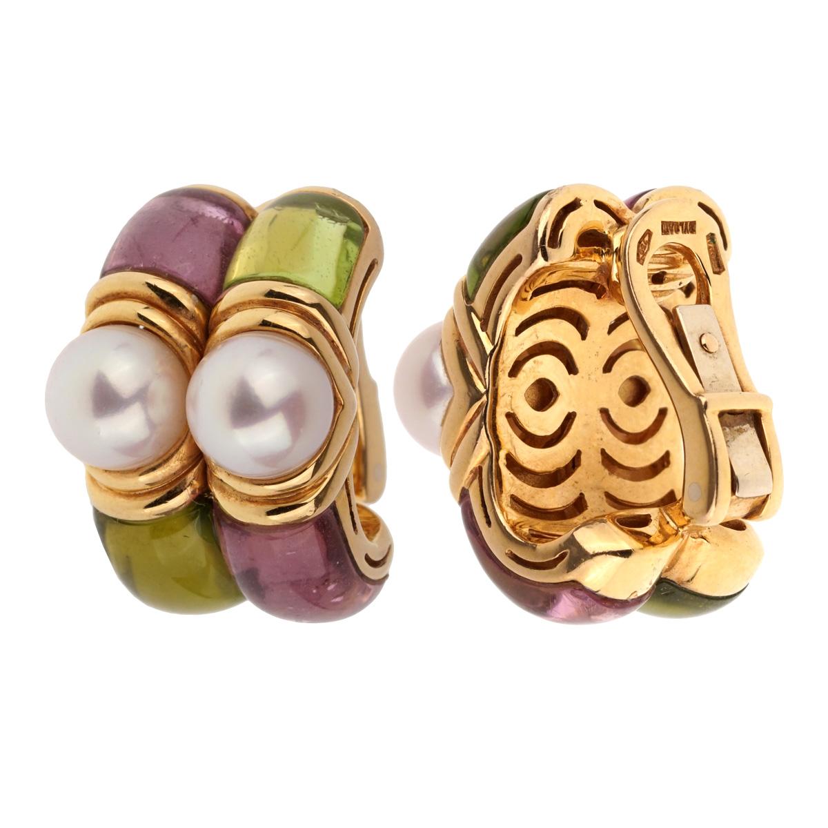 A chic pair of Bulgari earrings featuring carved Amethyst, Peridot, and Pearls in 18k yellow gold. The earrings measure 1/2