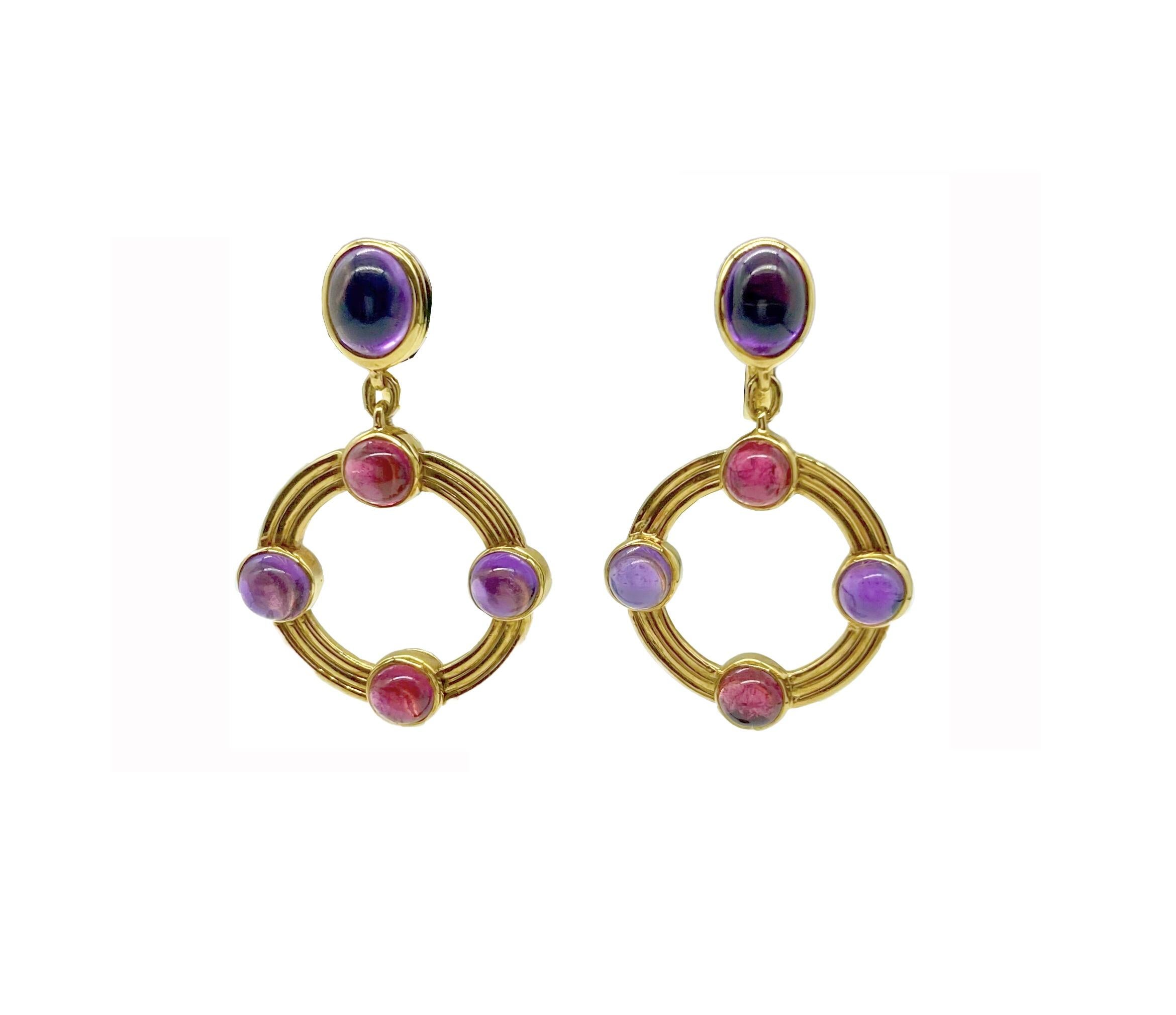 A chic pair of Bulgari 18 karat yellow gold drop earrings with cabochon amethysts and pink tourmalines. Made in Italy. 
