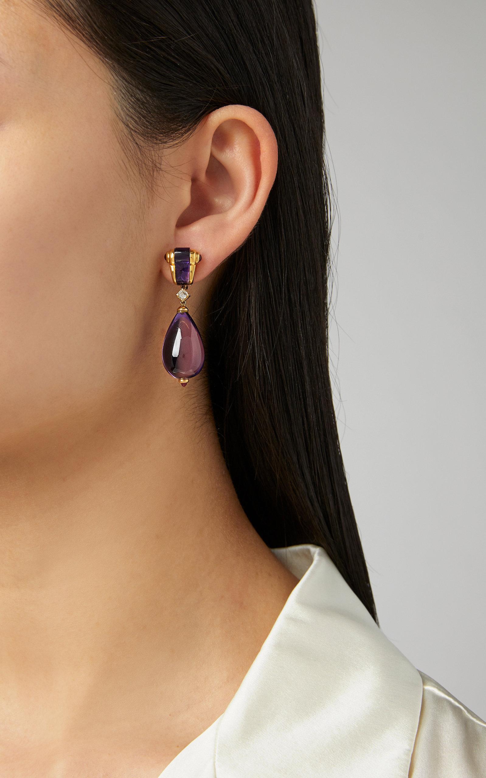 Bulgari ear-pendants in 18kt yellow gold with fine amethyst drops, diamonds and cabochon rubies.  Italy, circa 1980s.