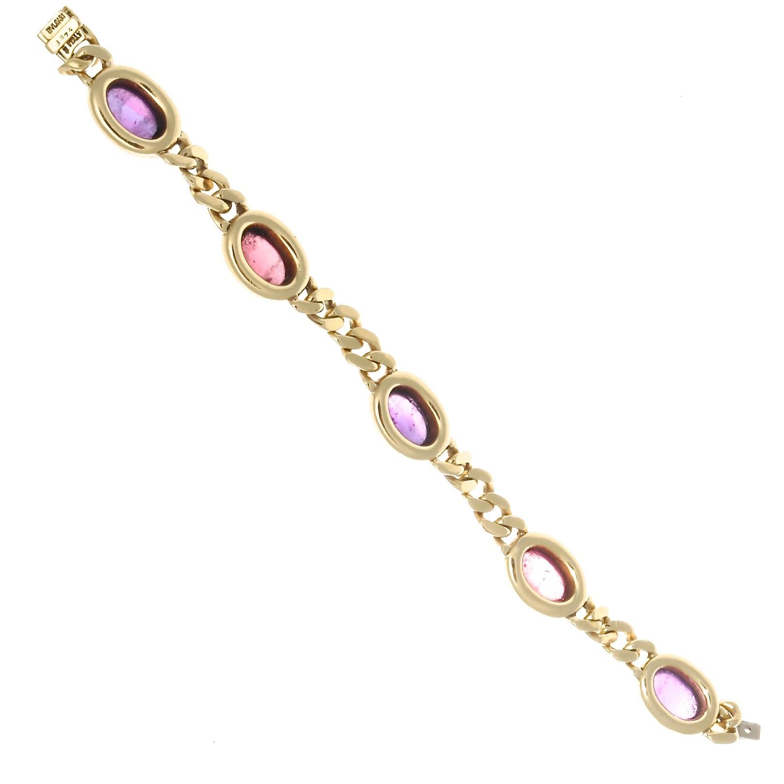 Elegant Italian design has always been the hallmark of Bulgari. Their jewelry is colorful feminine and bold. Featuring vibrant cabochon cut purple amethyst and pink tourmaline alternating between golden links of 18k gold. Signed Bulgari.