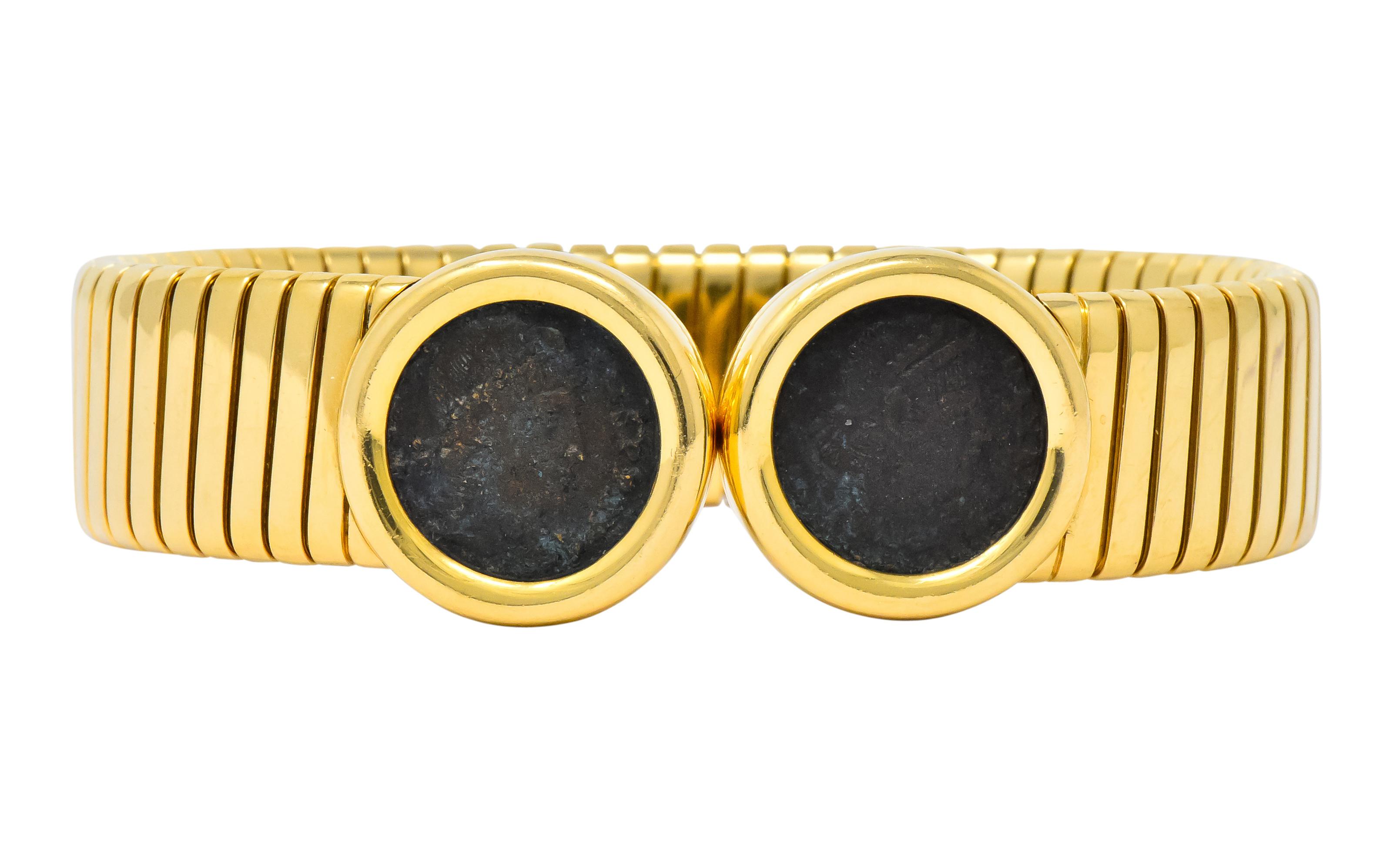 Flexible tubogas style bangle

With bezel set ancient coin terminals

Coins depict the profile of Emperor Constans of Rome

Inscribed on coin bezel verso 'Roma Constans I AVG A.D. 337-350'

From the Monete collection 

Fully signed Bulgari with