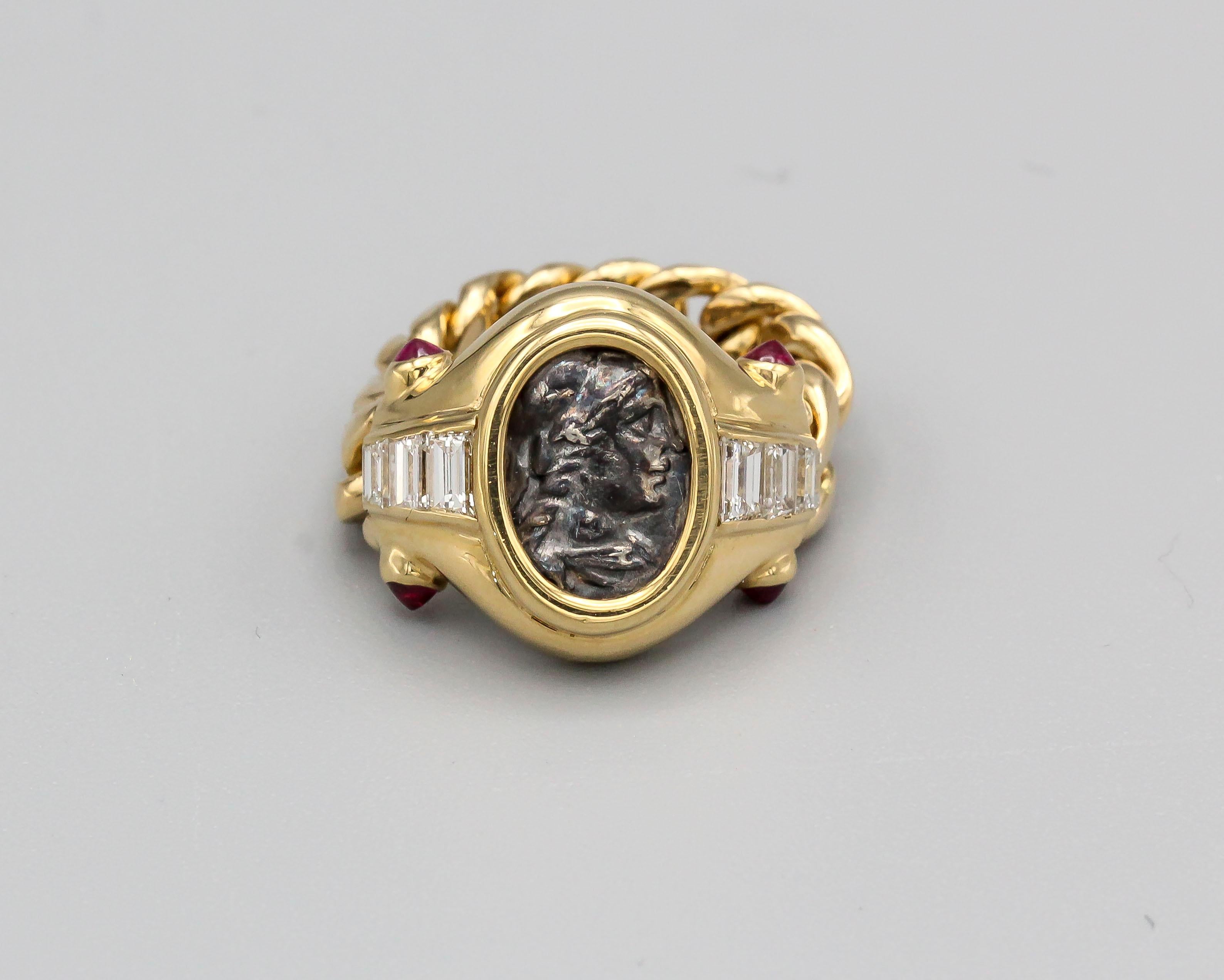 Rare and unusual diamond, ruby, ancient Roman coin and 18K yellow gold flexible ring by Bulgari, circa 1970s. It features a Roman coin dated 2nd century B.C. Diamonds are high grade tapered baguette cut, with rich red rubies on sides. Approx. size
