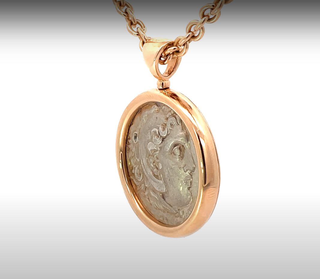 This Bulgari necklace is a true masterpiece, showcasing an ancient Macedonian coin from the era of Alexander the Great, 336-323 B.C., elegantly set in an 18k rose gold frame. The necklace is a stunning creation by Bulgari, the renowned Italian