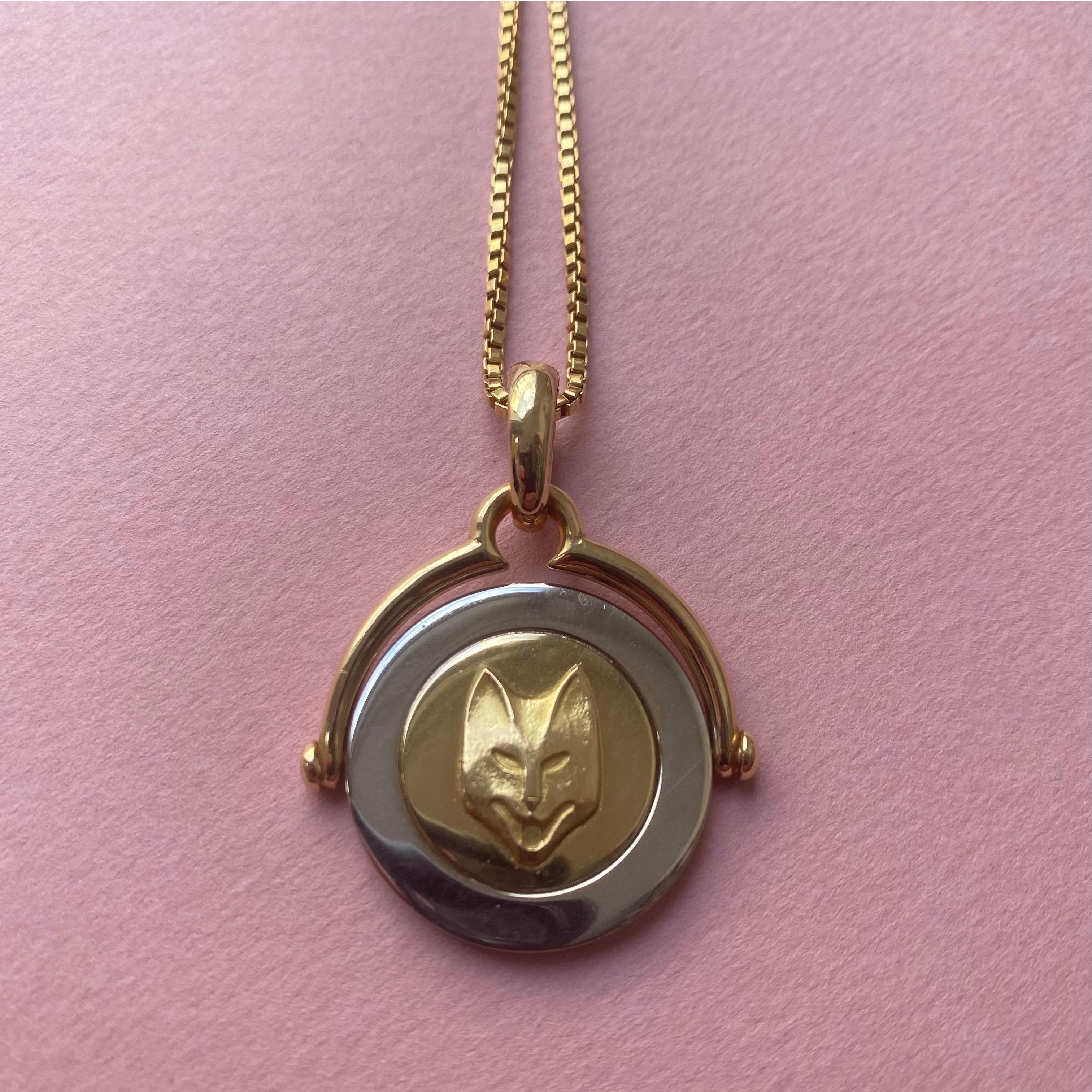 An 18 carat white and yellow gold Swivel pendant of a cat or a fox signed and made by Bulgari for Balthus in France.

weight: 33.8 grams including 18 carat gold chain
size: 4 x 3 cm